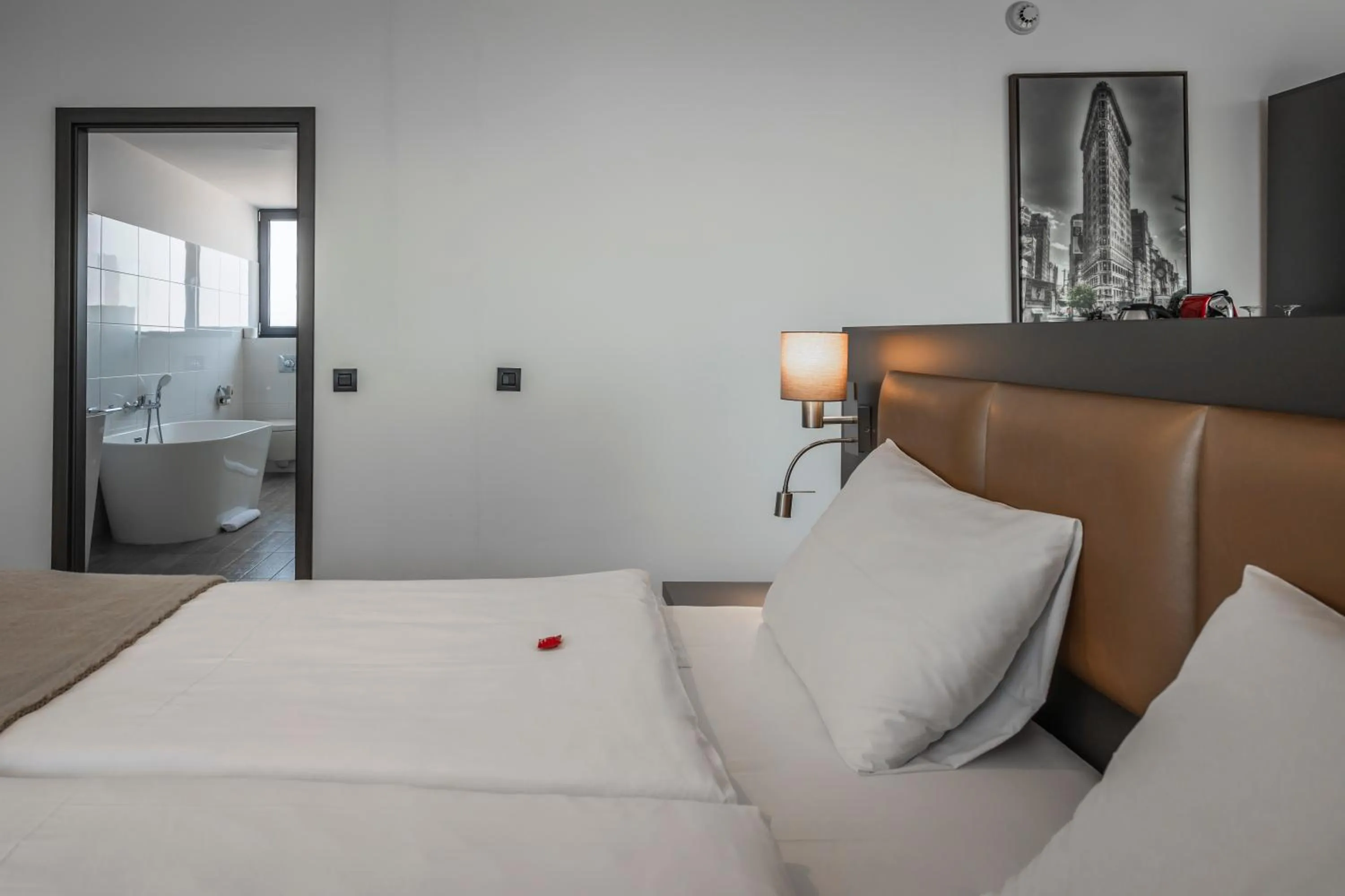 Bed in Charm Boutique Hotel