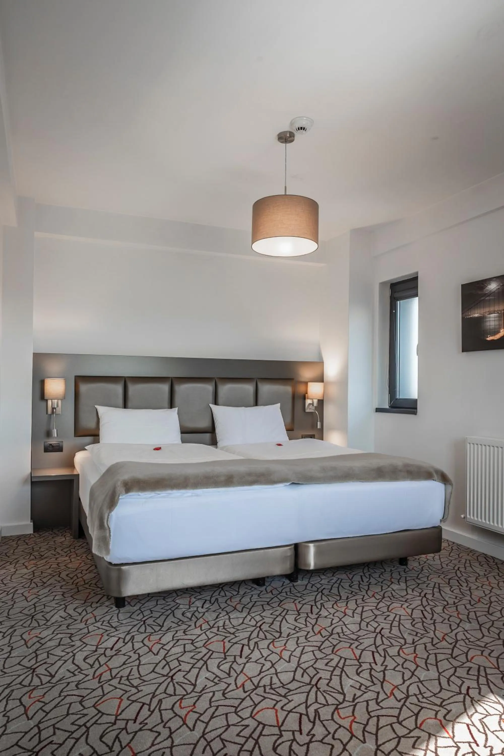 Bed in Charm Boutique Hotel