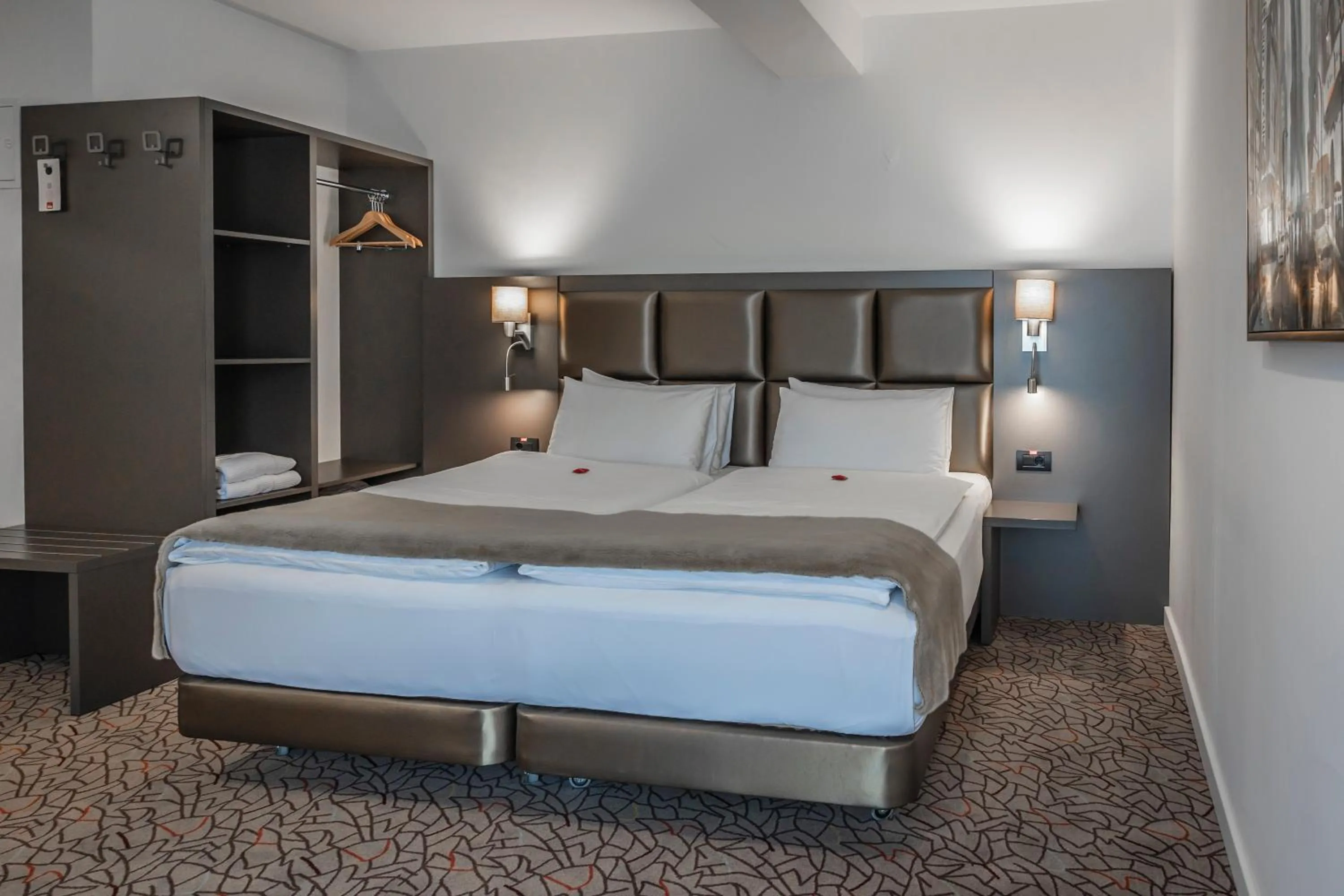 Bed in Charm Boutique Hotel