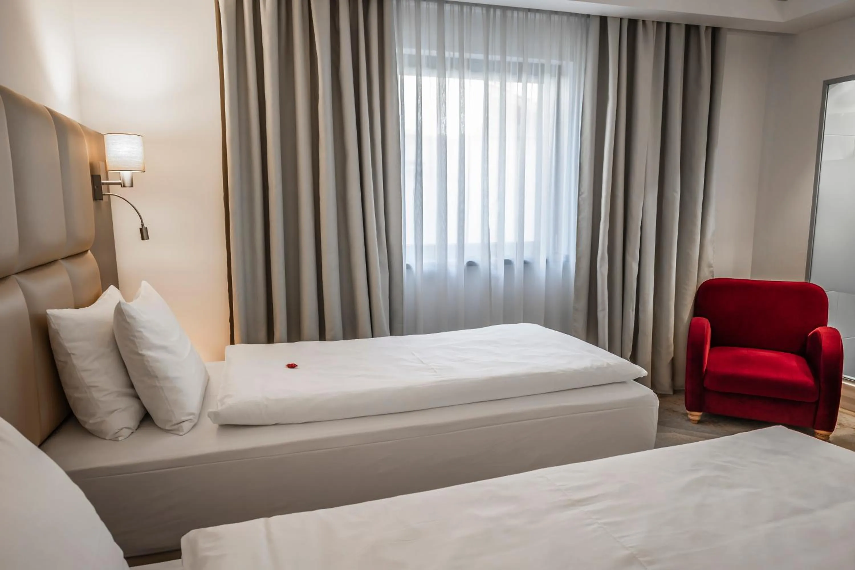 Bed in Charm Boutique Hotel