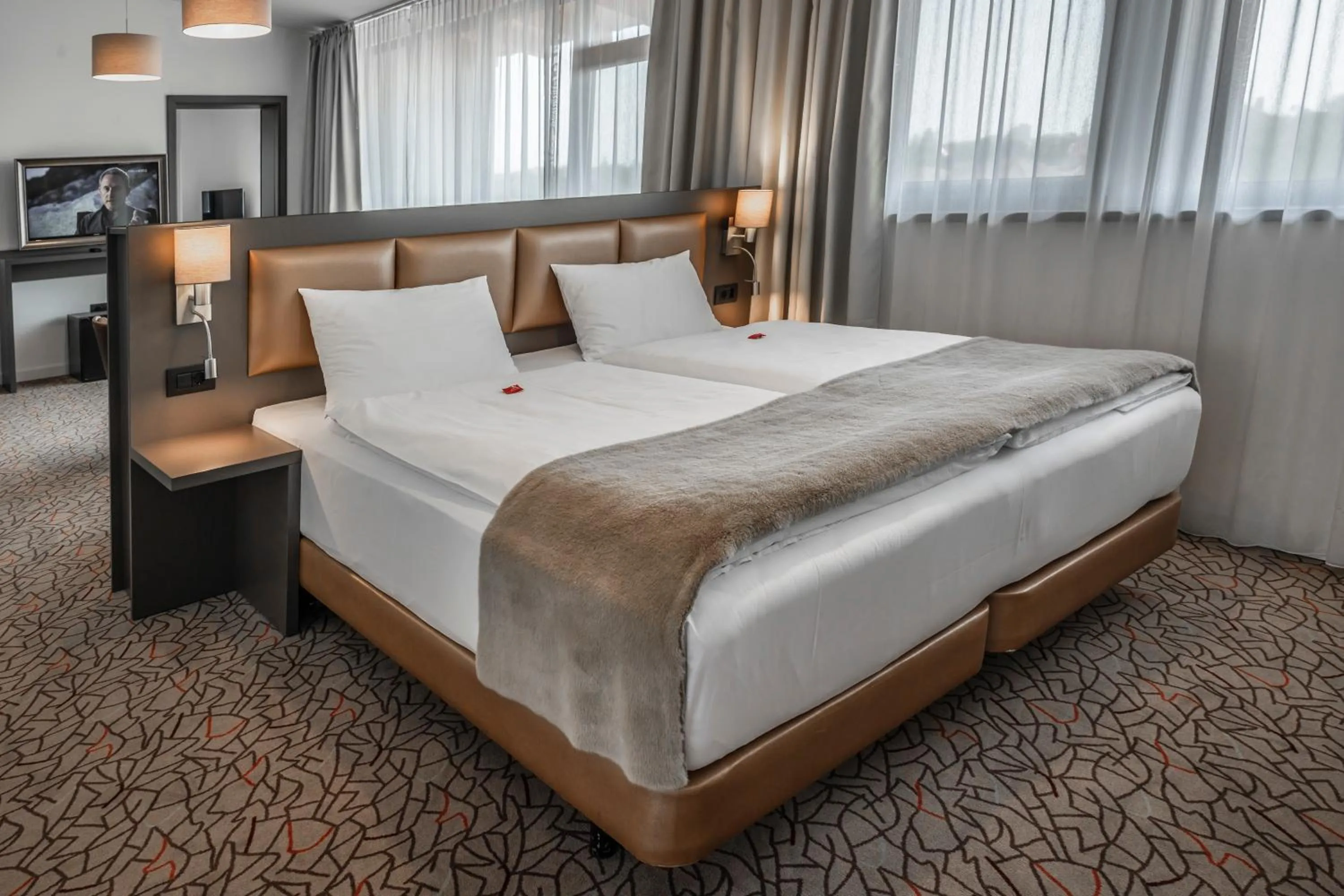 Bed in Charm Boutique Hotel