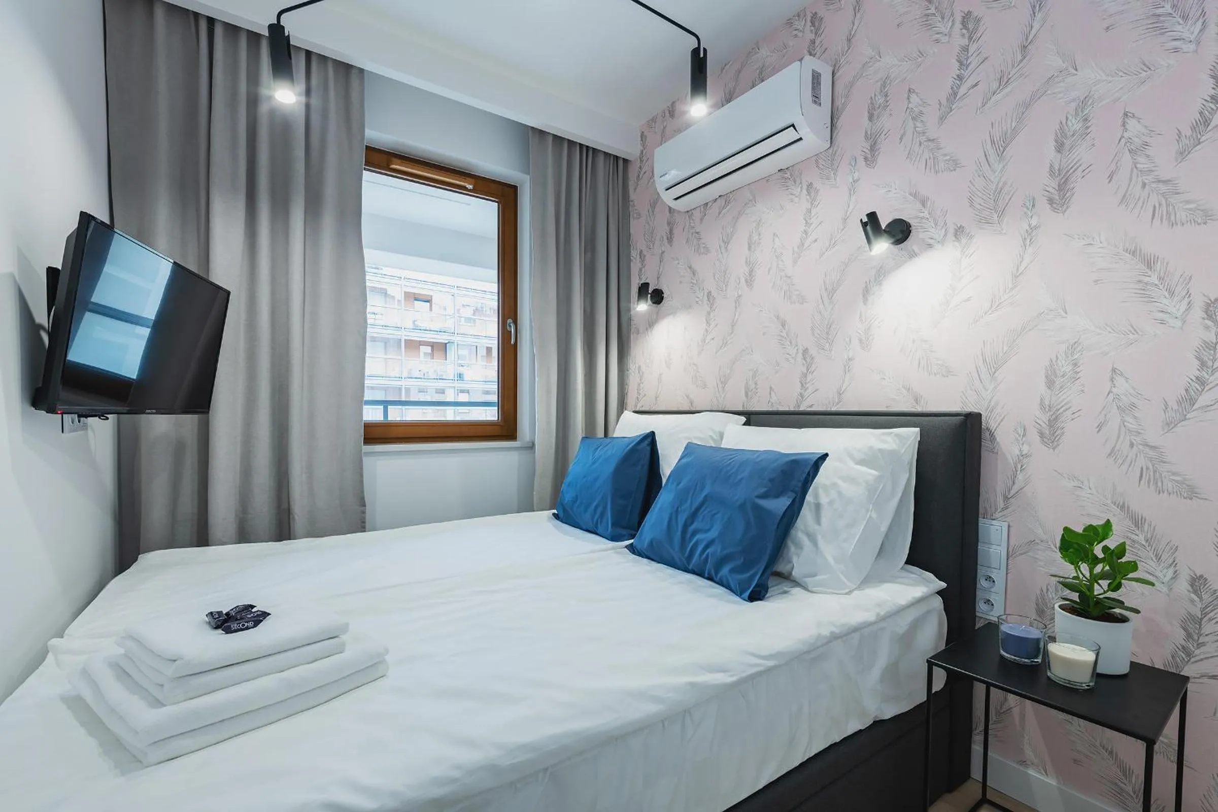 Bed in YourSecondFlat Grzybowska