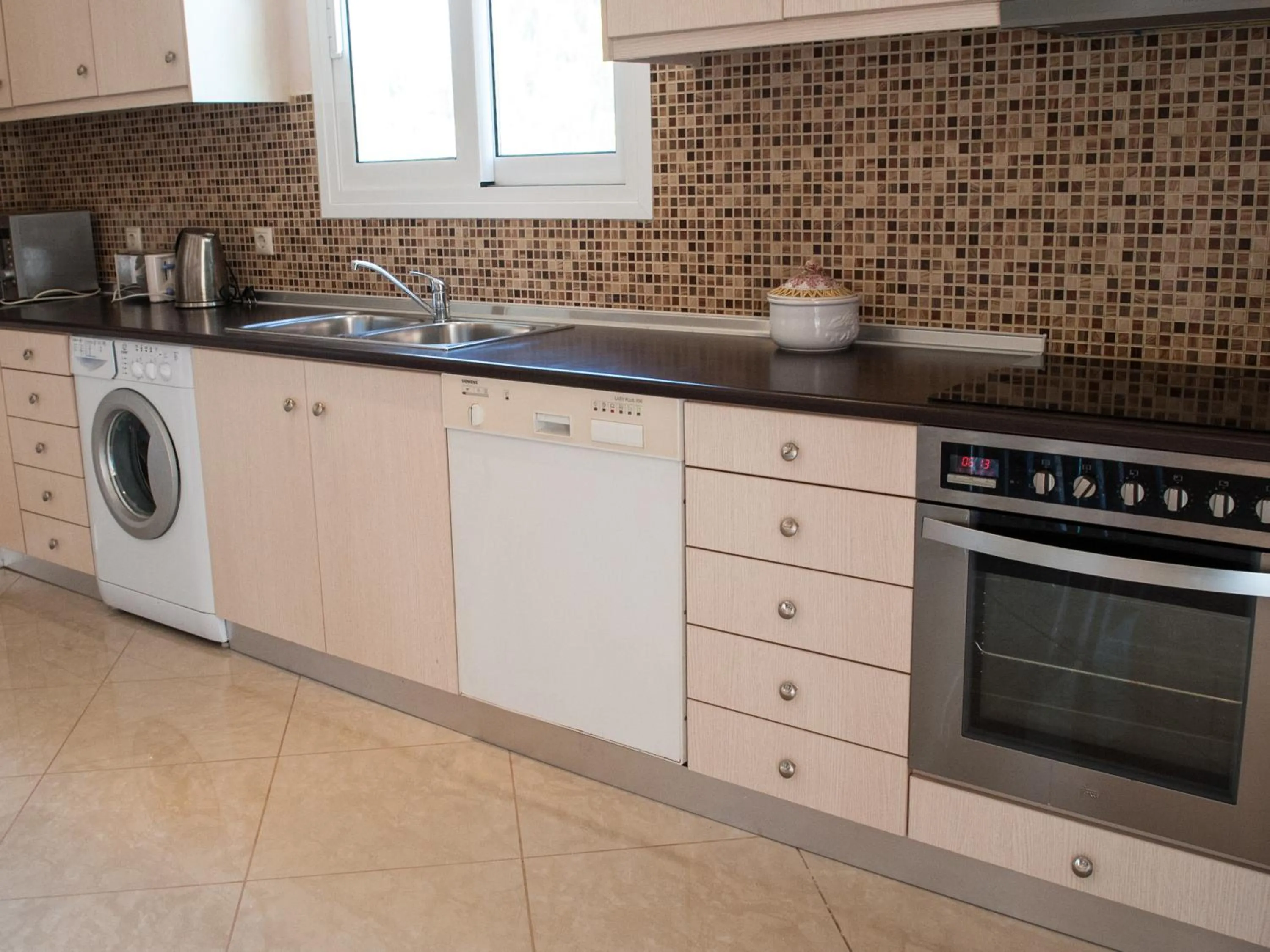 Kitchen or kitchenette in Residence Poseidon