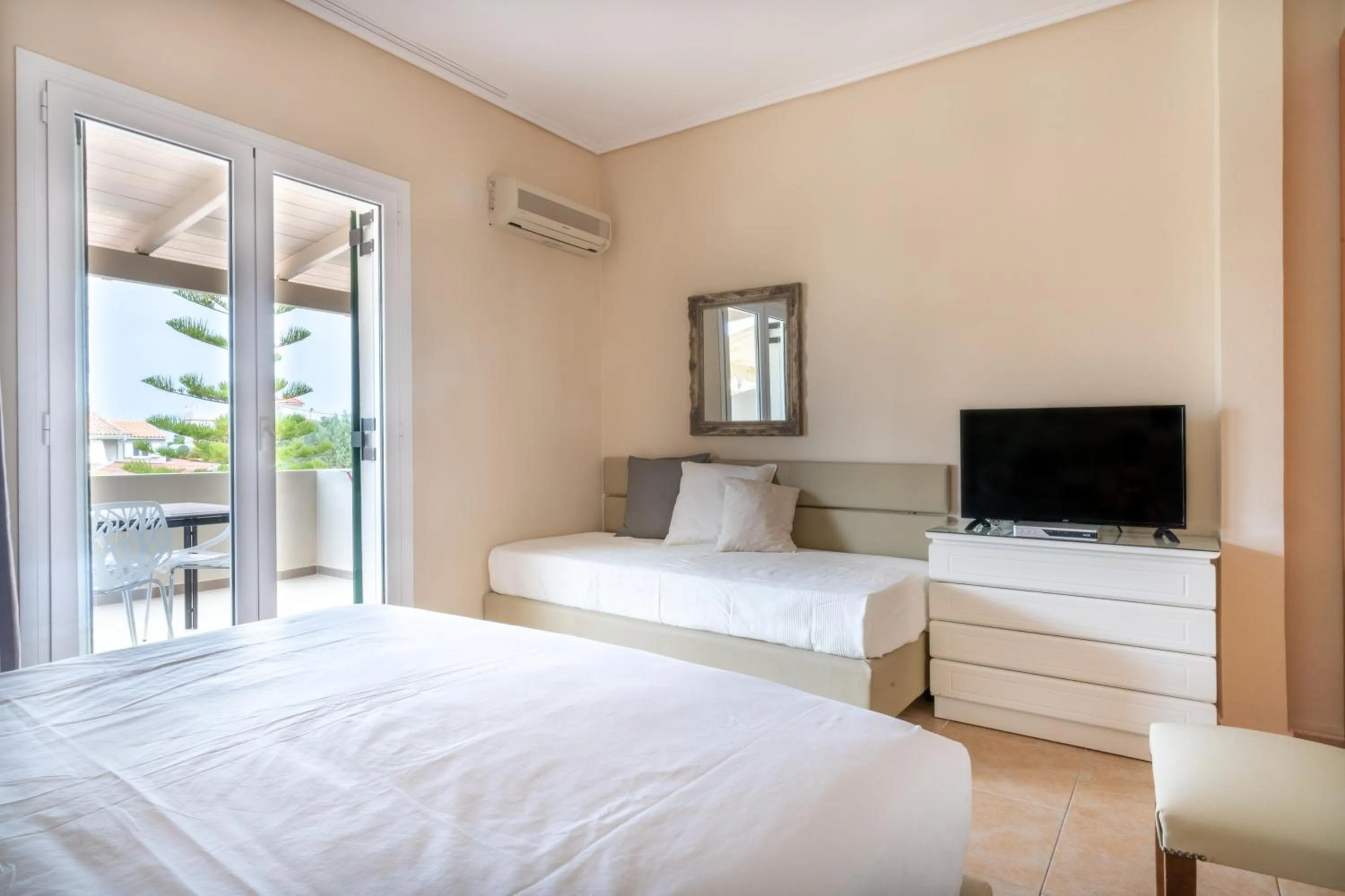 Photo of the whole room, Bed in Residence Poseidon