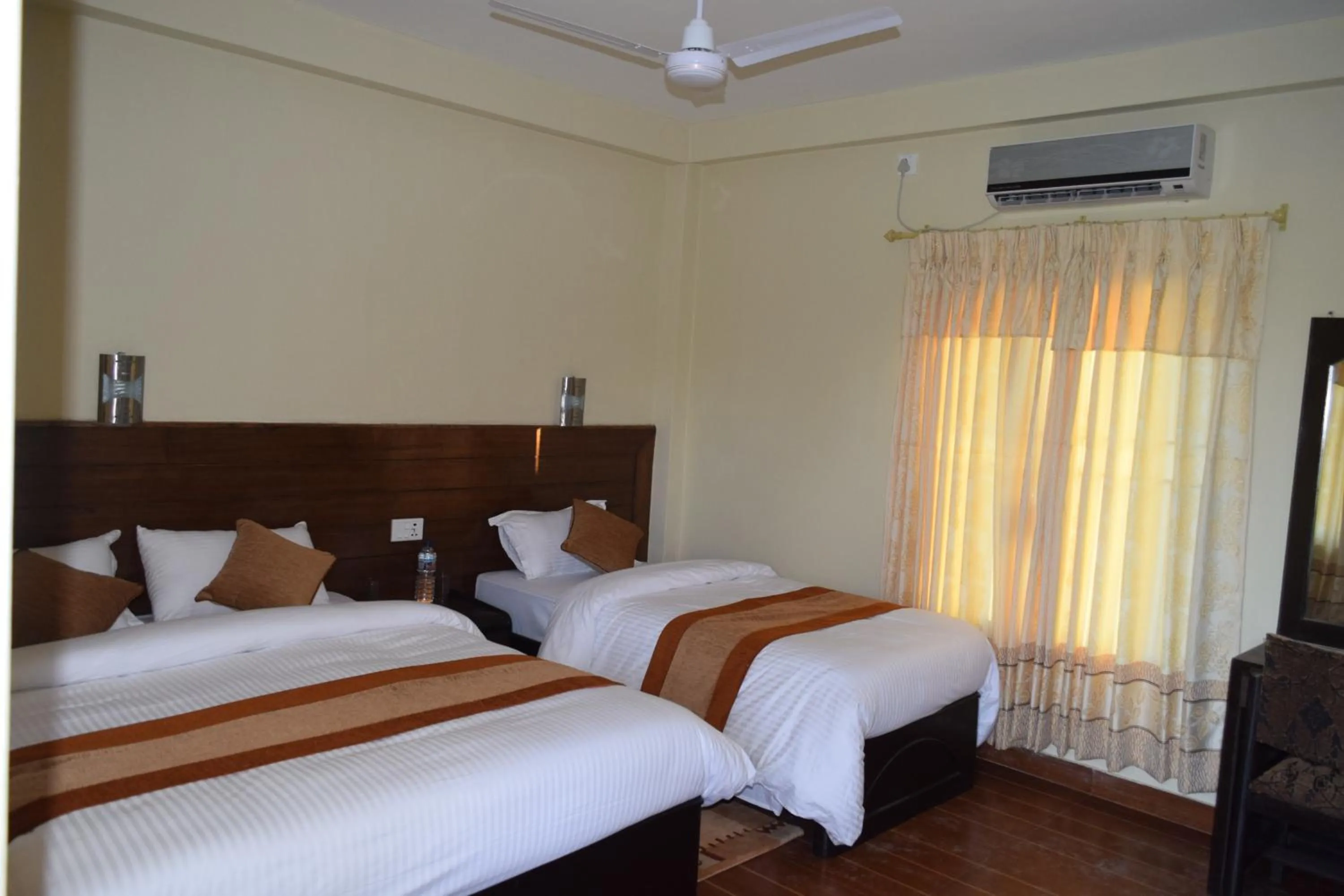 Bed in Chitwan Village Resort