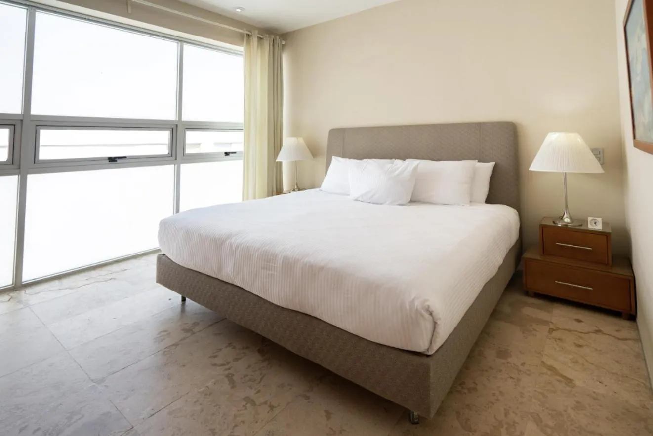 Bed in Magia Beachside Apartment by BVR