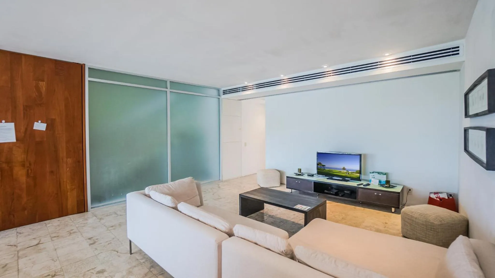 Living room in Magia Beachside Apartment by BVR