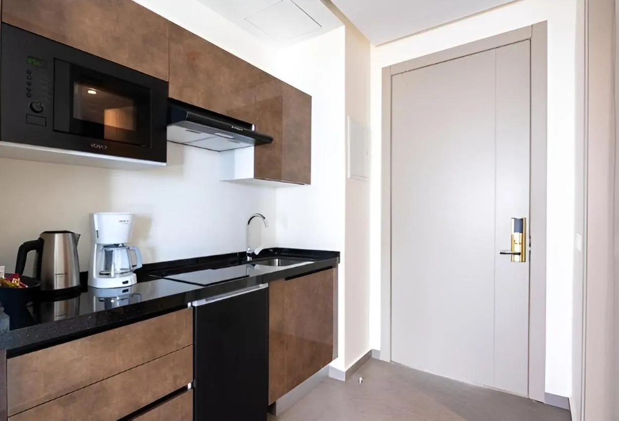 Kitchen or kitchenette in Le Tanger Résidence Hôtelière