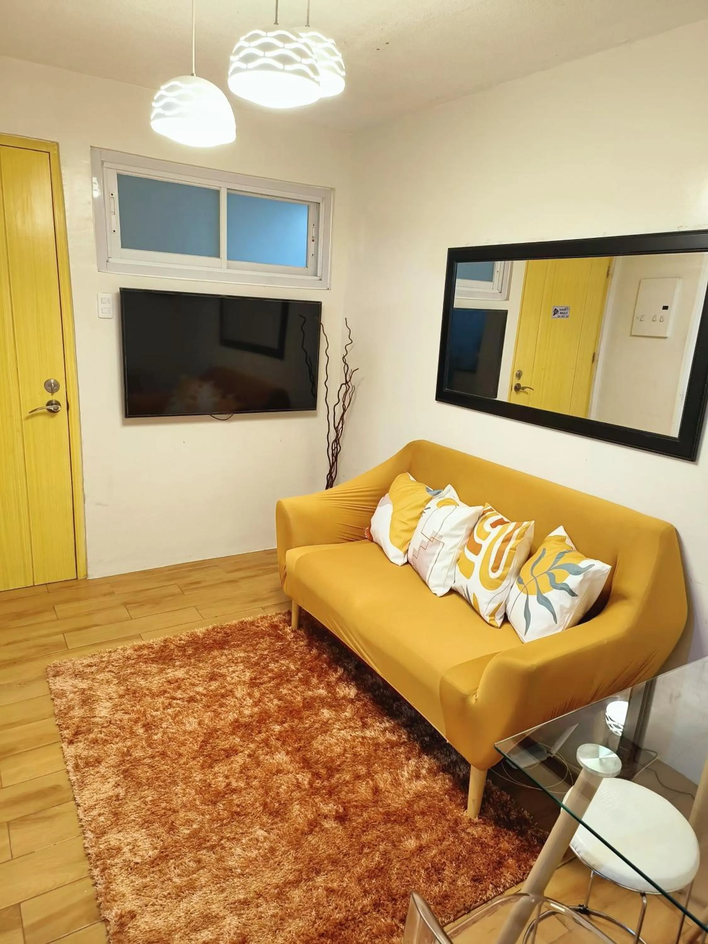 Living room in Davao Condo 2BR Pool Wifi Netflix