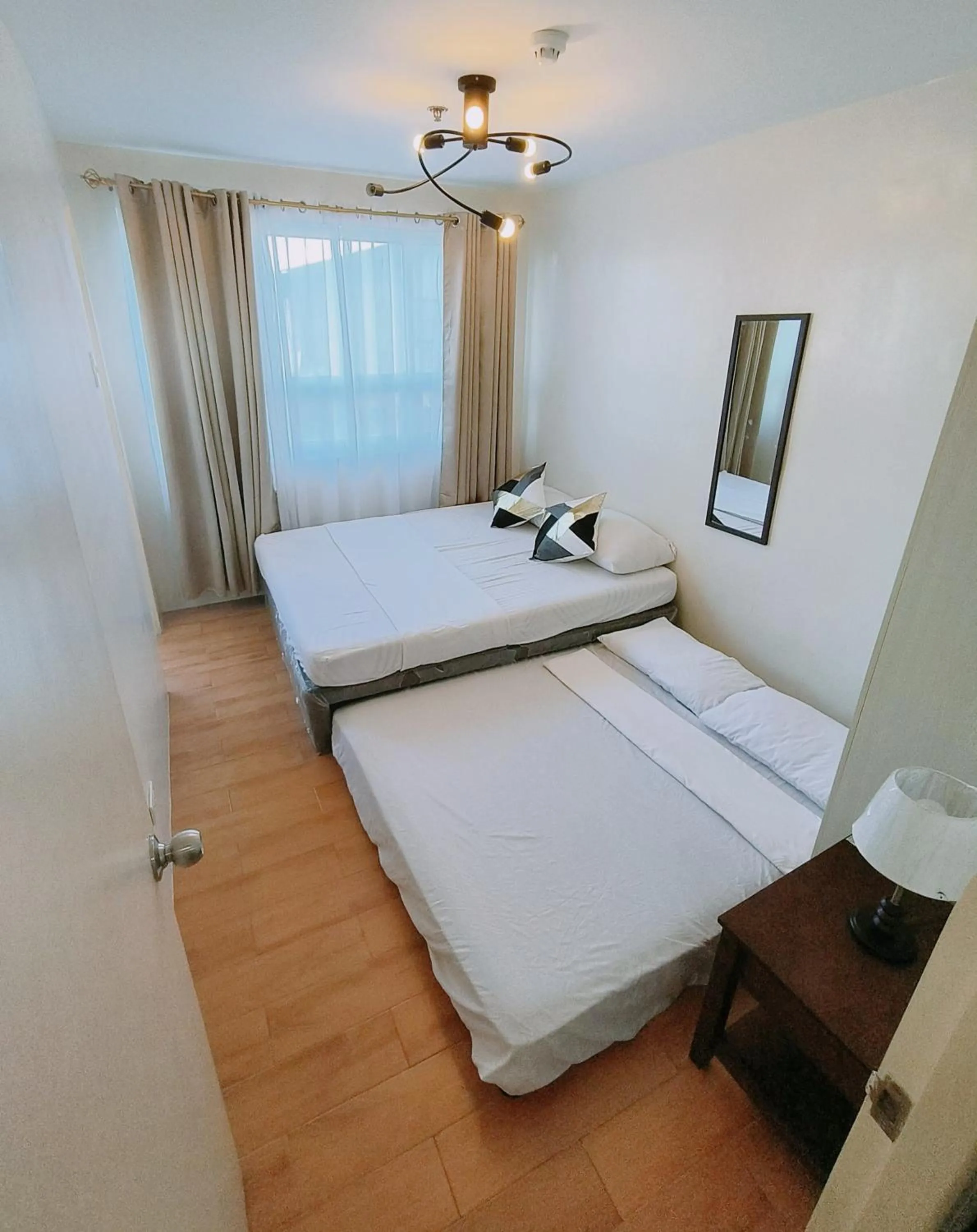 Bed in Davao Condo 2BR Pool Wifi Netflix