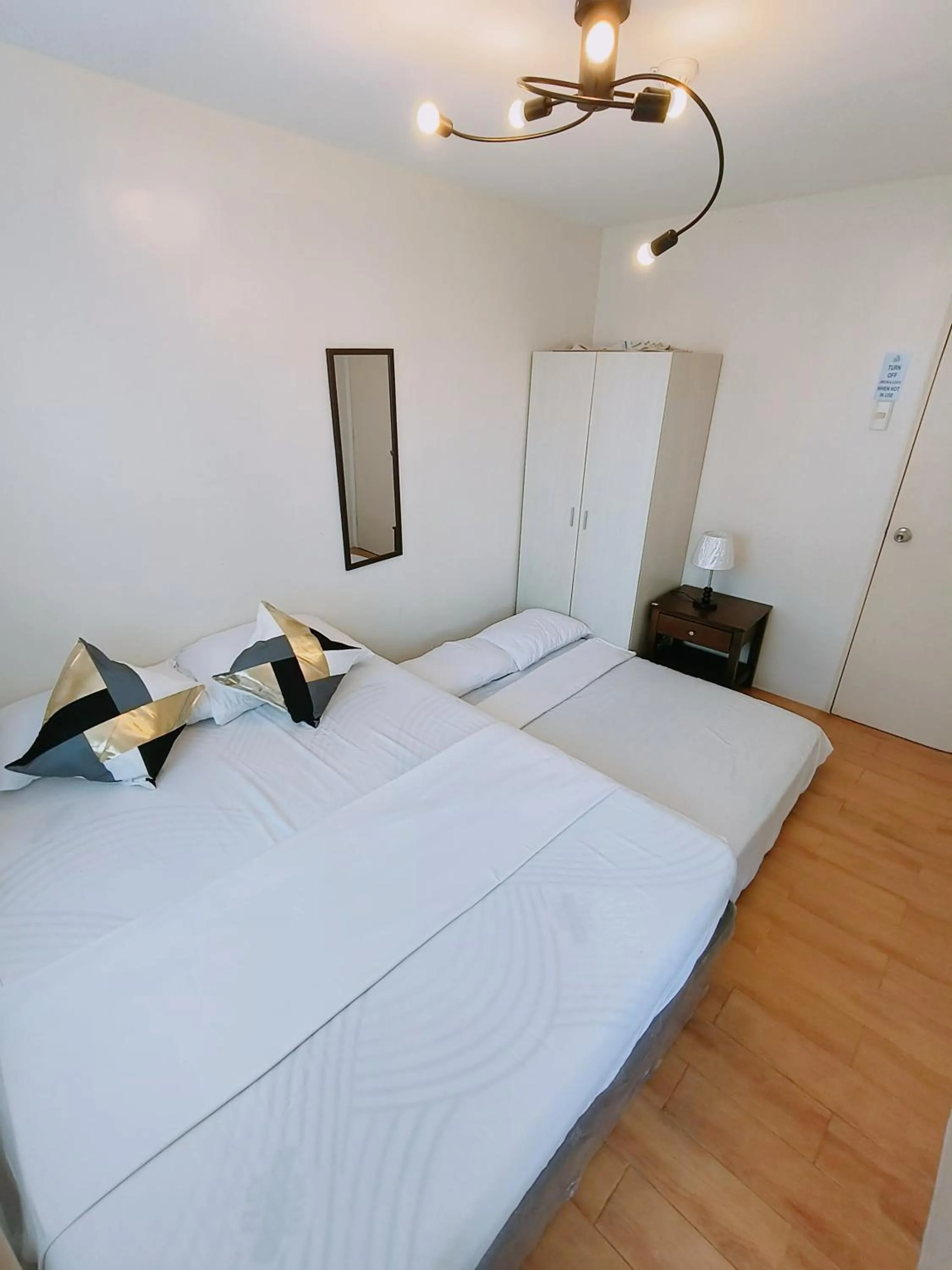 Bed in Davao Condo 2BR Pool Wifi Netflix