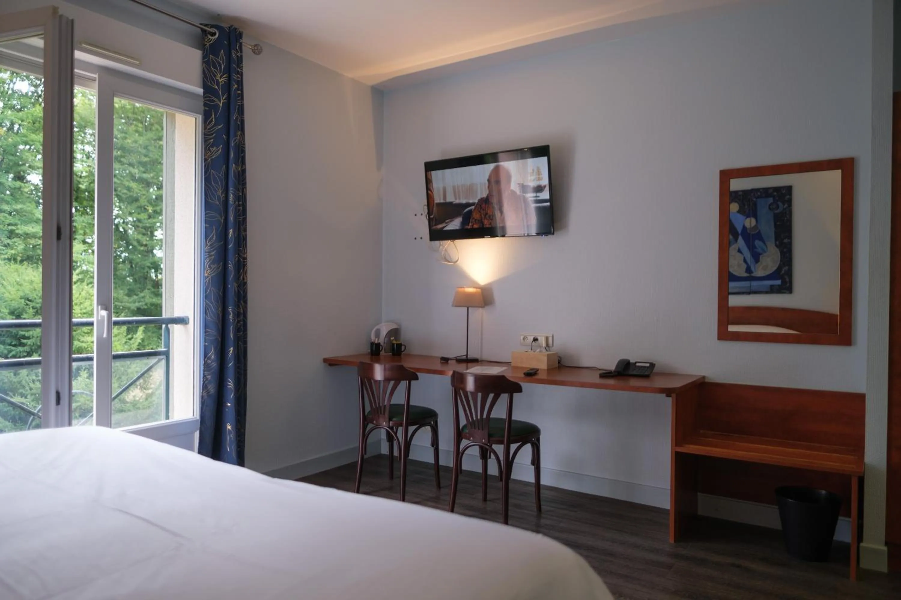 Bedroom, Bed in Logis Hôtel - Restaurant Le Tulipier