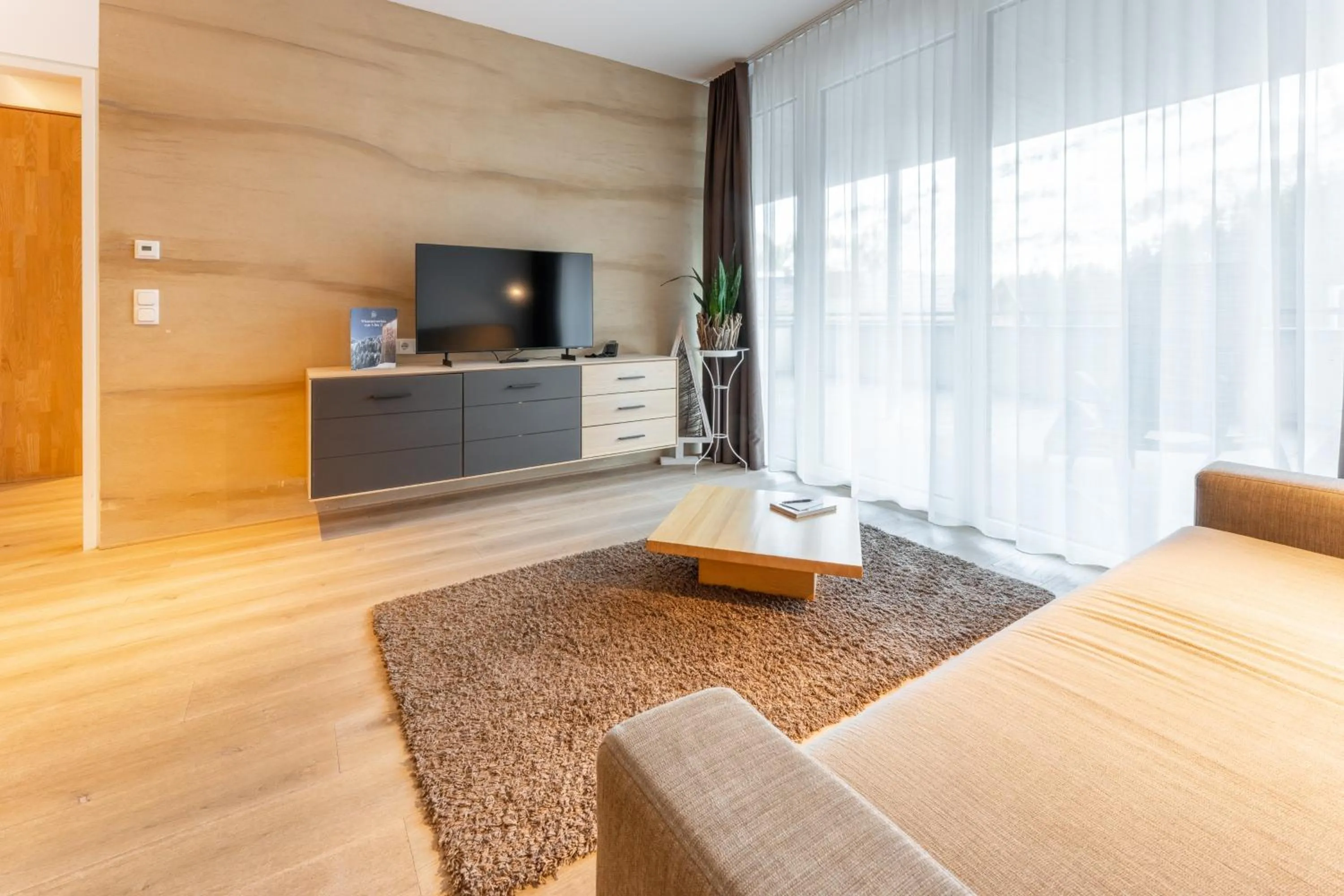 Living room, Bed in Aparthotel Alpinresort Damüls