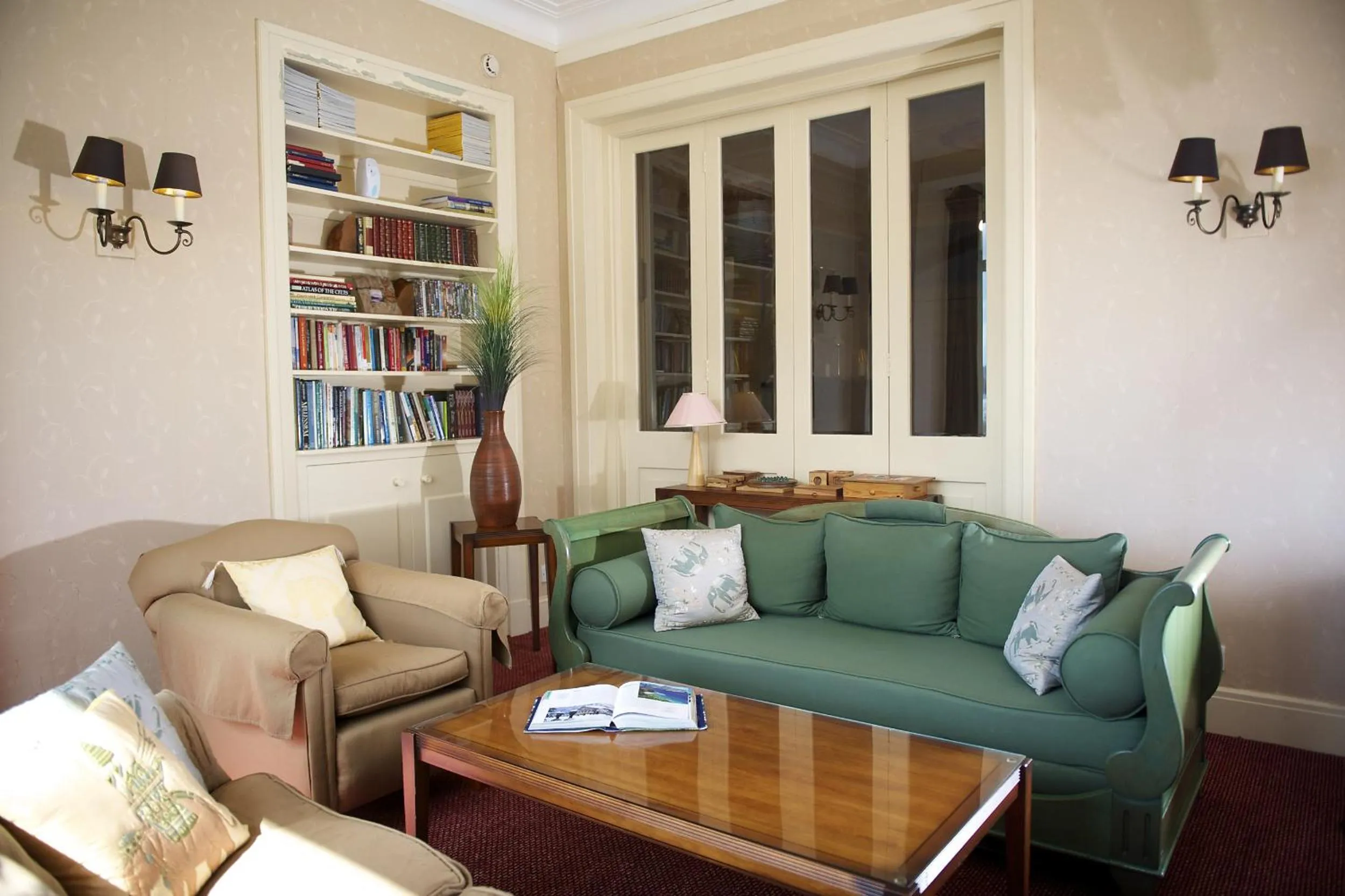 Seating area in The Lodge on the Loch by OYO