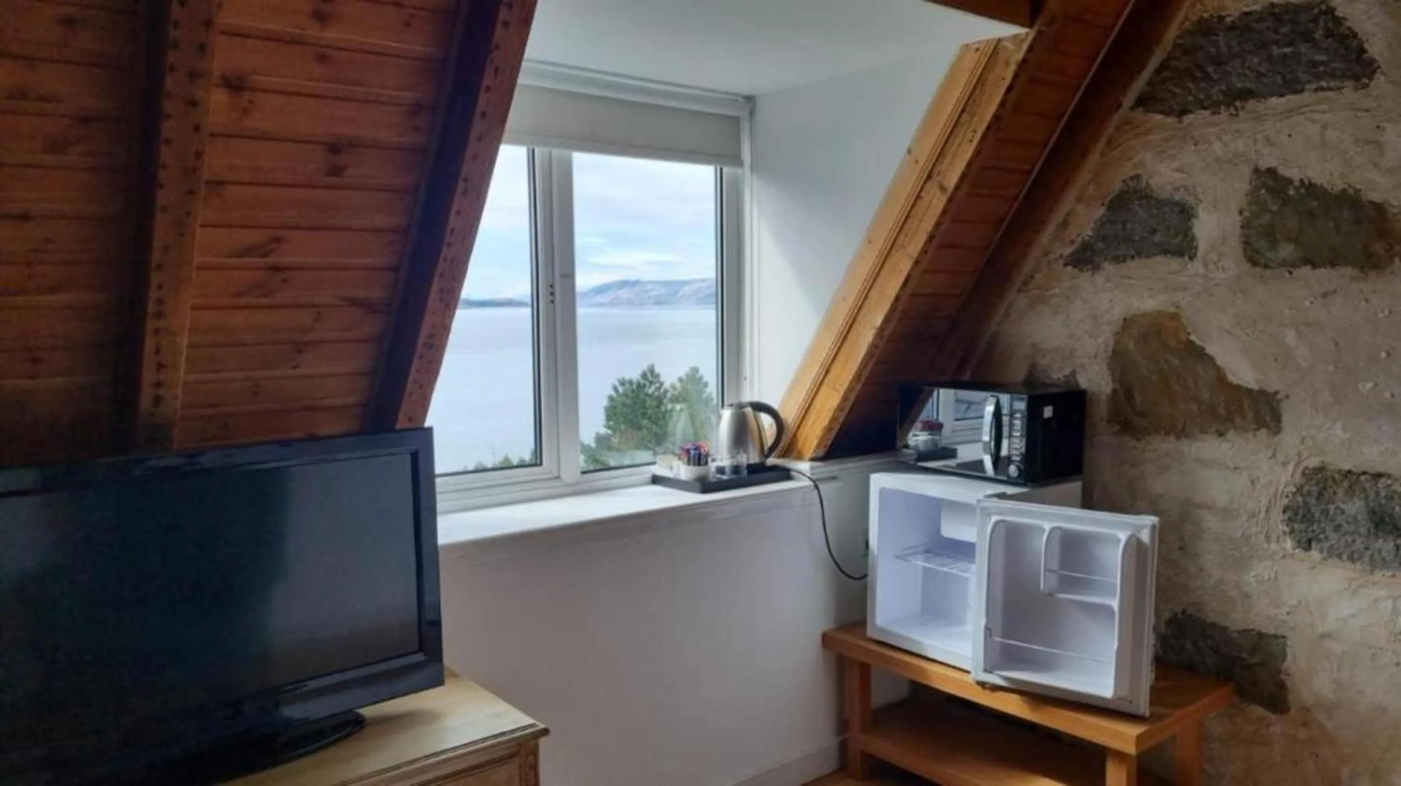 TV and multimedia in The Lodge on the Loch by OYO