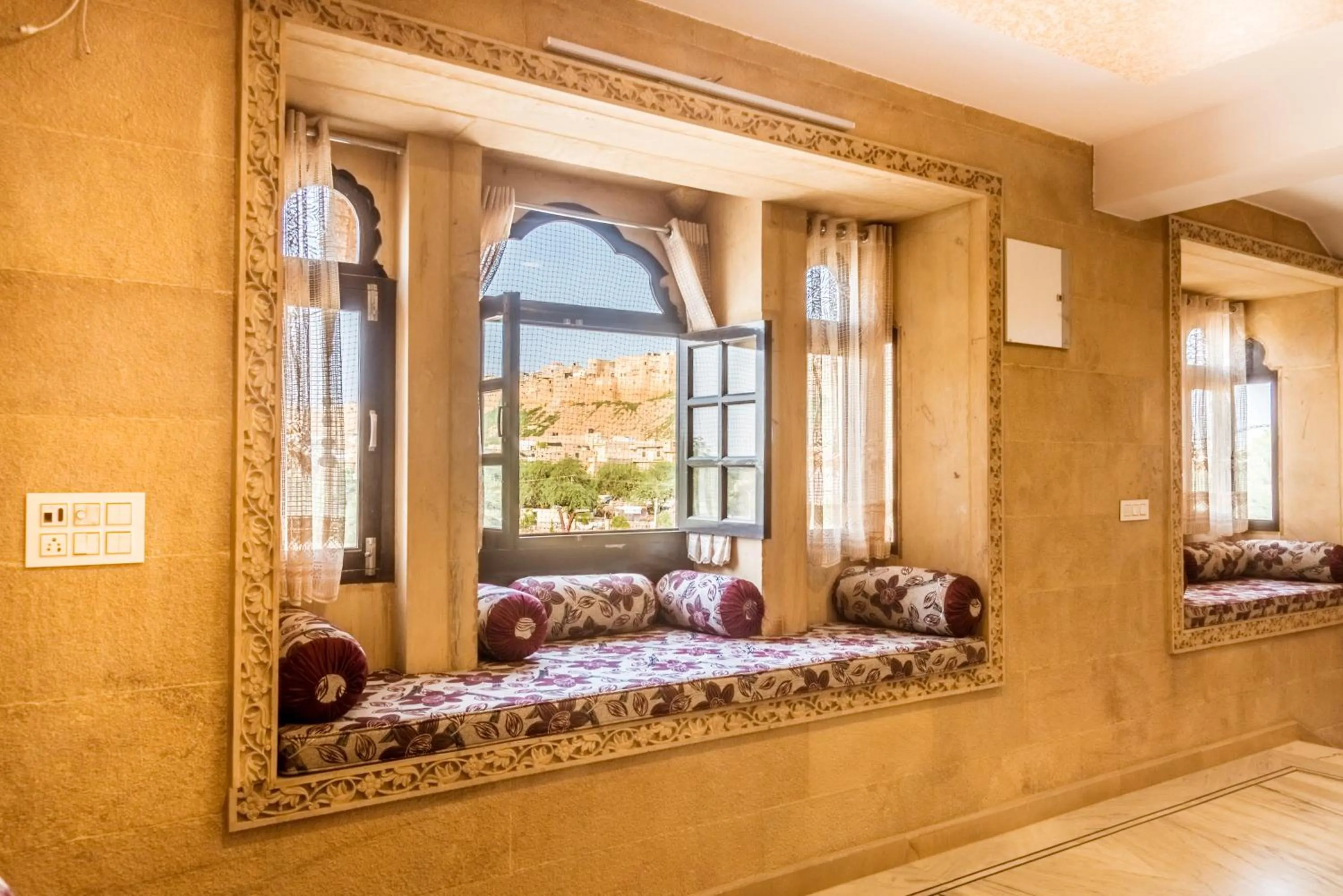 Seating area, Bed in Hotel Sky Plaza - Best ever view of Jaisalmer Fort