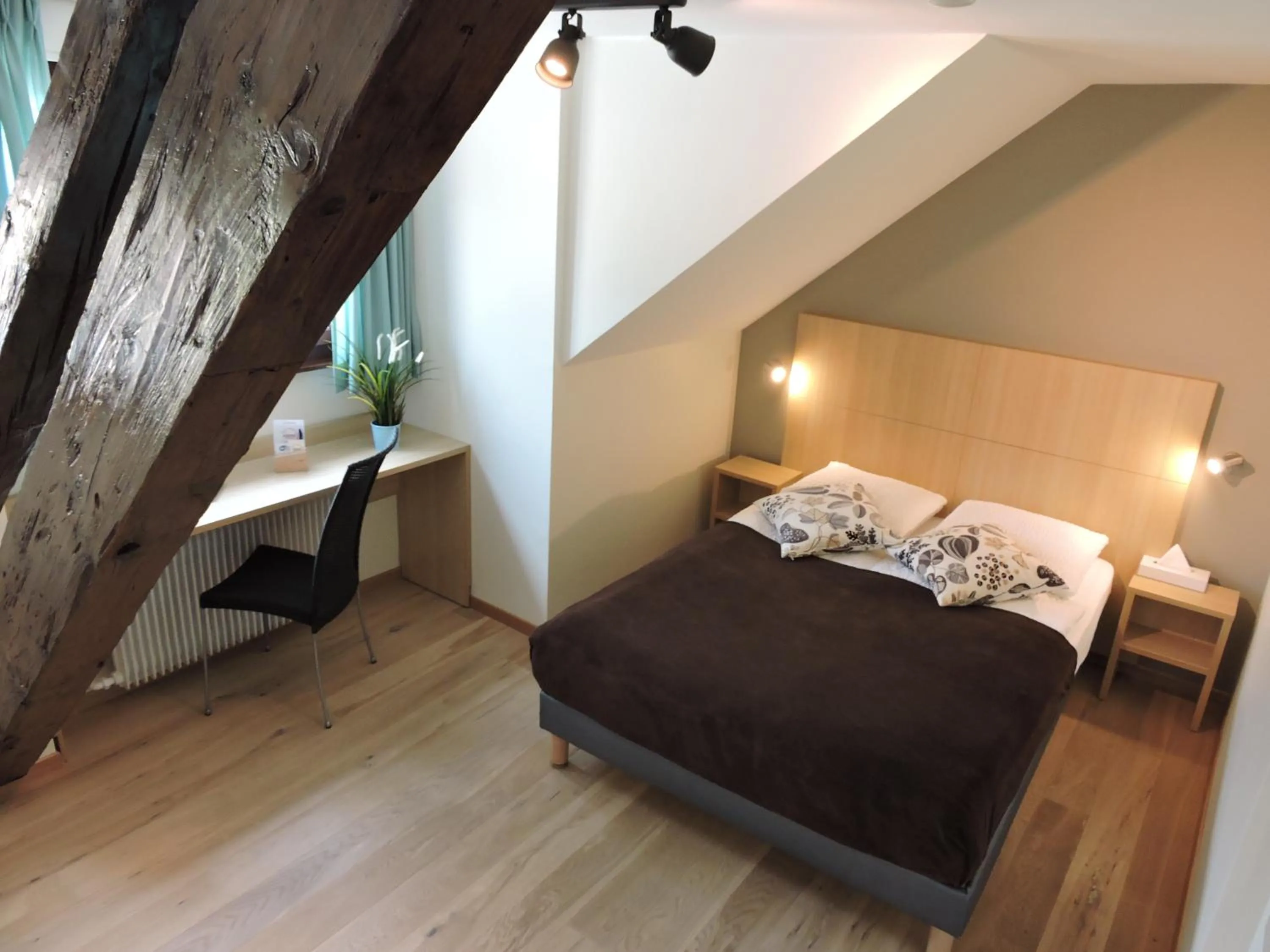 Photo of the whole room, Bed in Auberge Communale de St-Légier