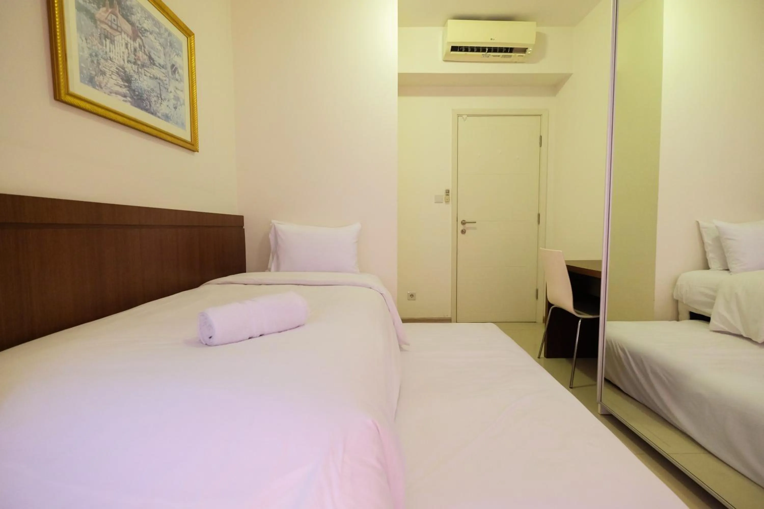 Bedroom, Bed in Homey 2BR Apartment at Casa Grande Residence By Travelio