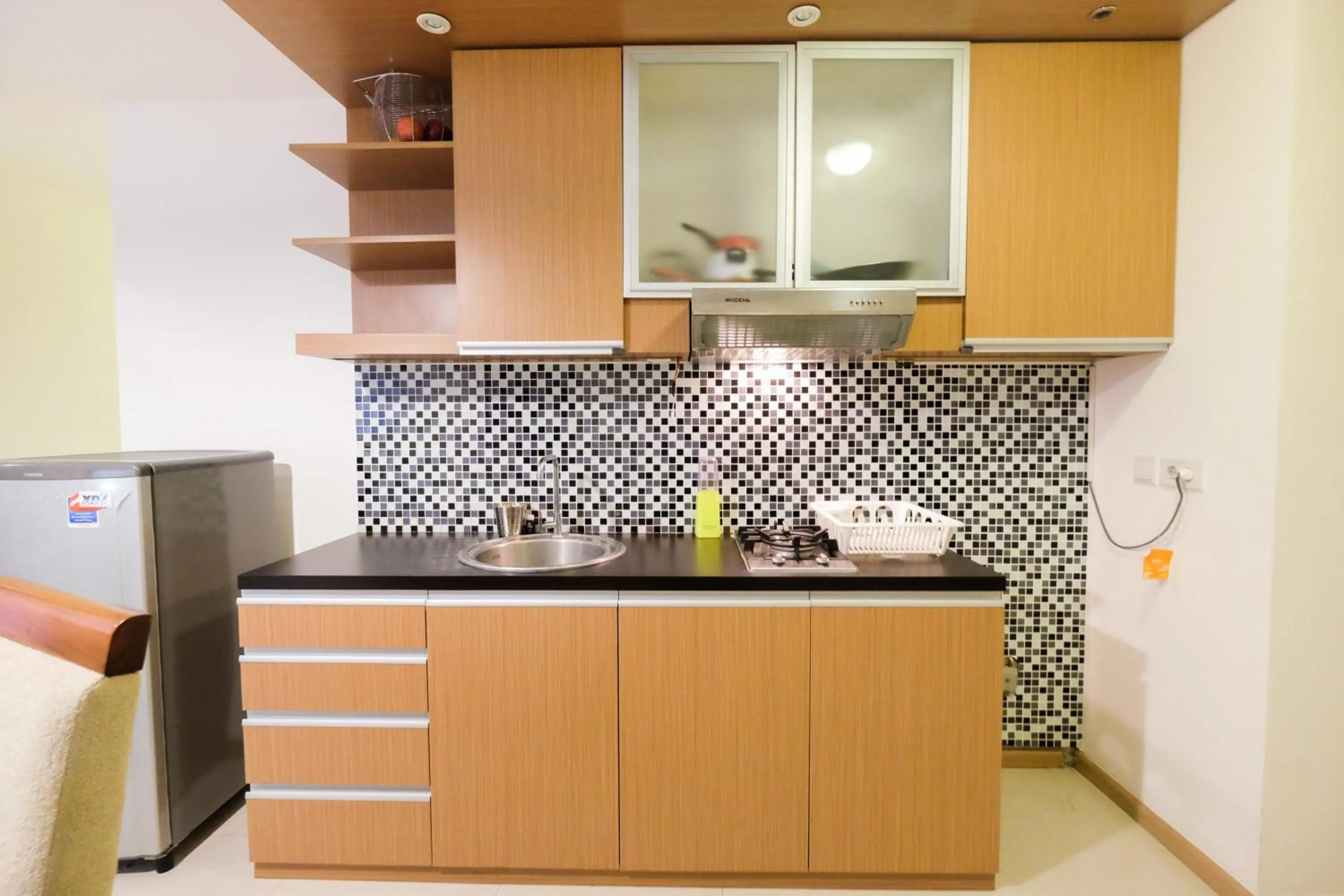 Kitchen or kitchenette in Homey 2BR Apartment at Casa Grande Residence By Travelio