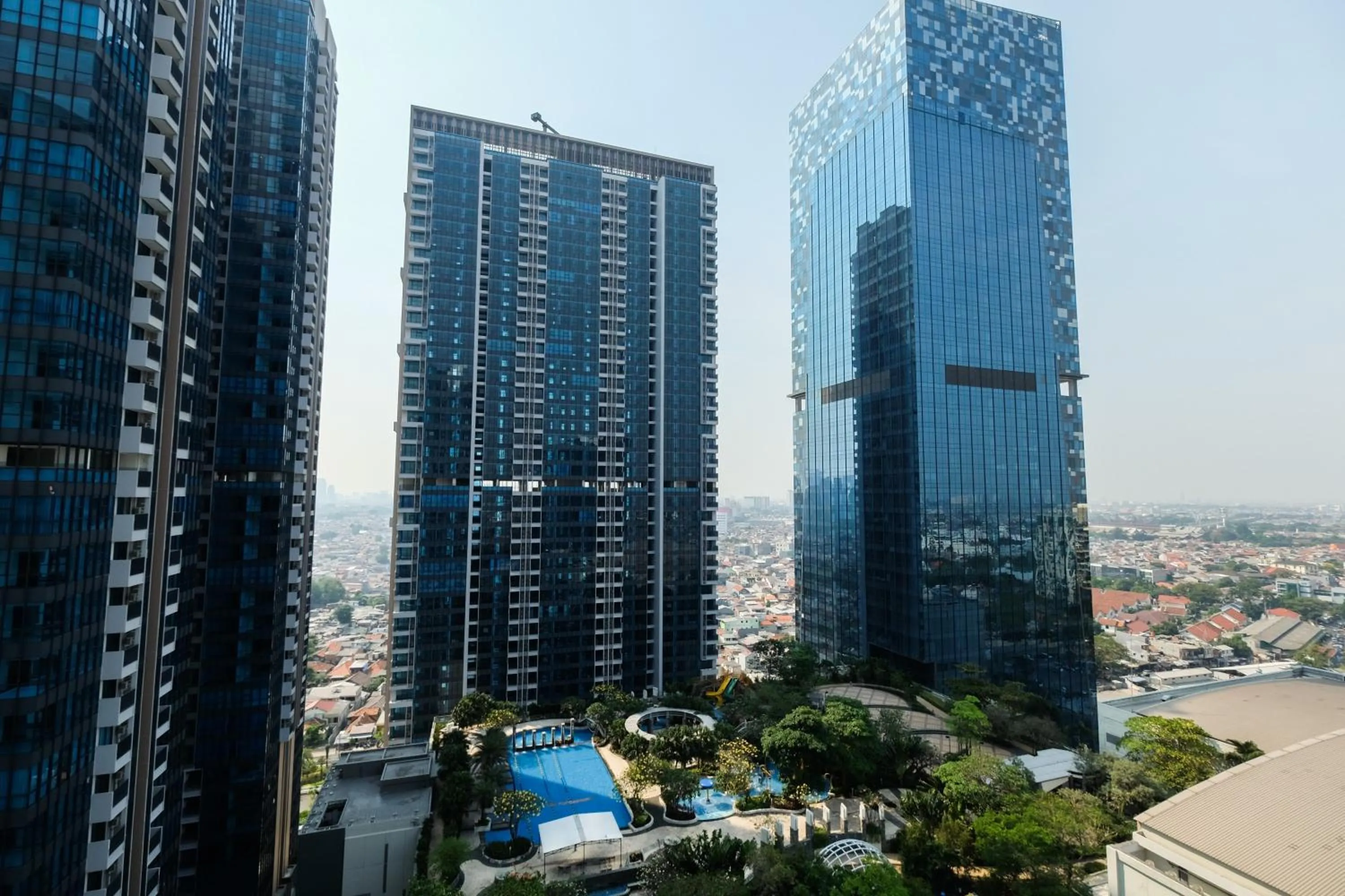 Property building in Homey 2BR Apartment at Casa Grande Residence By Travelio