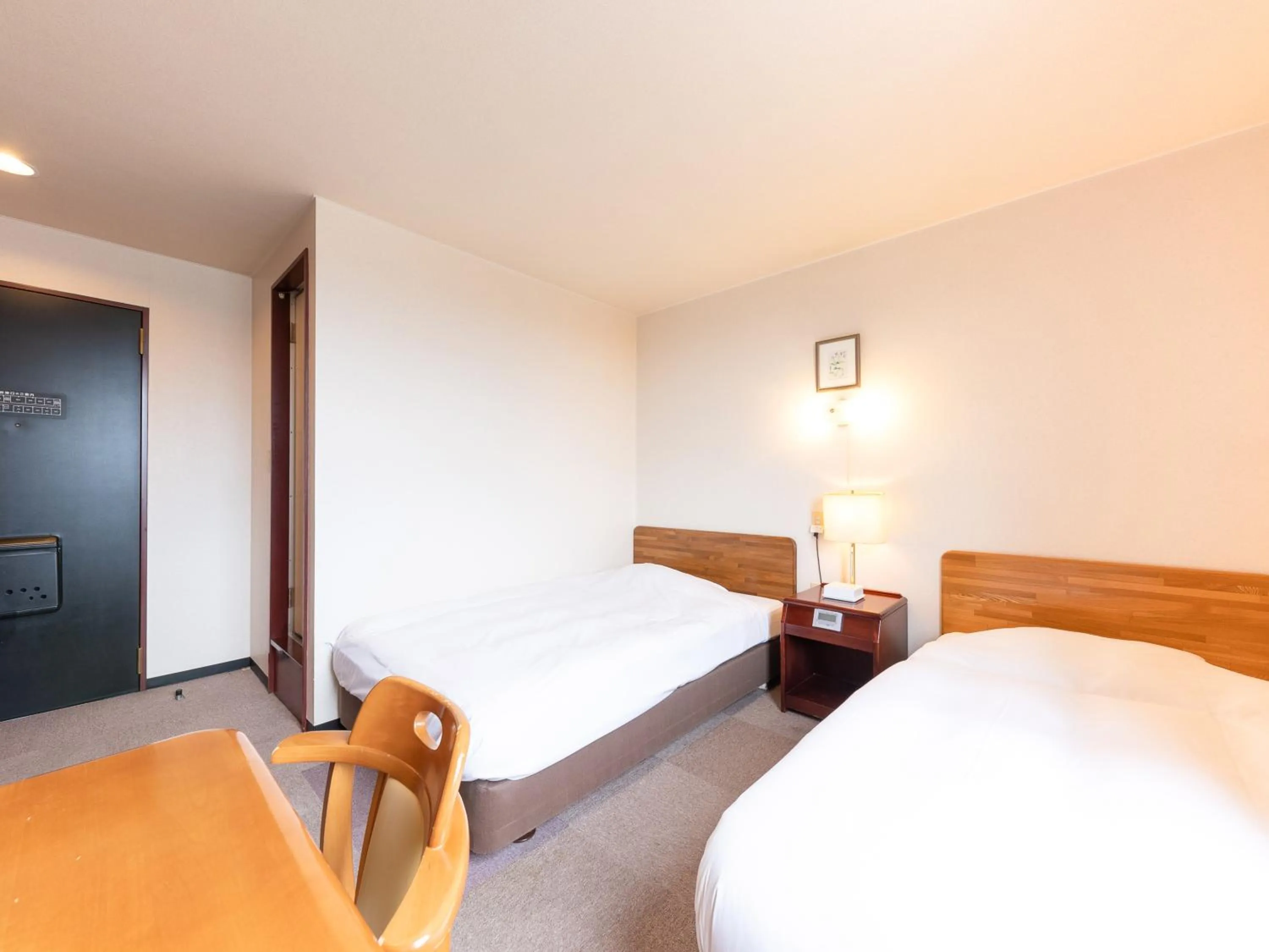 Bed in Tabist Travel Inn Shinshu Nakano