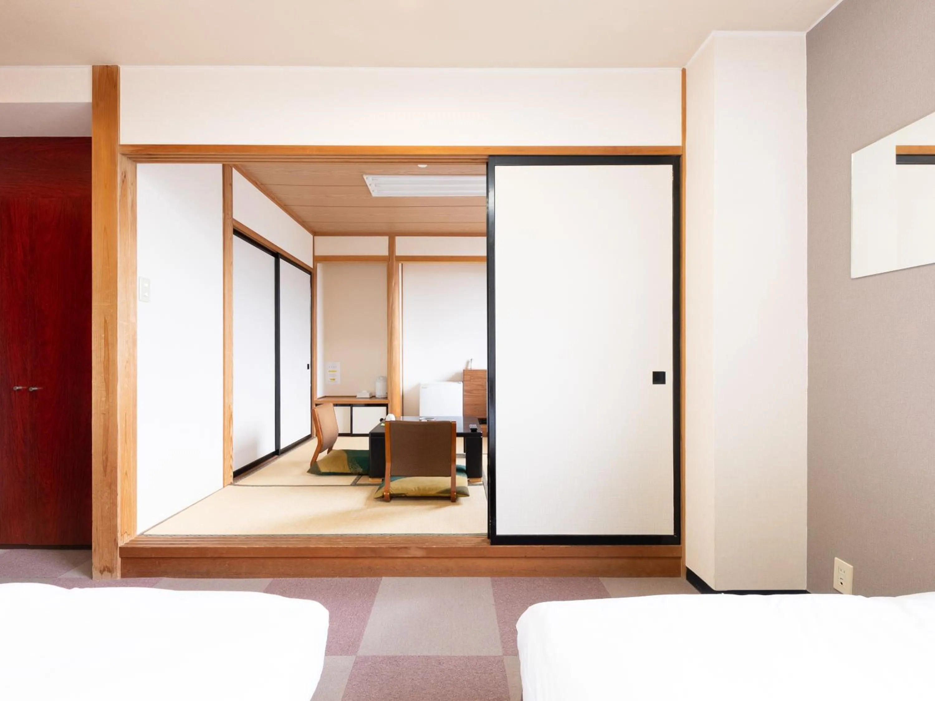 Bed in Tabist Travel Inn Shinshu Nakano