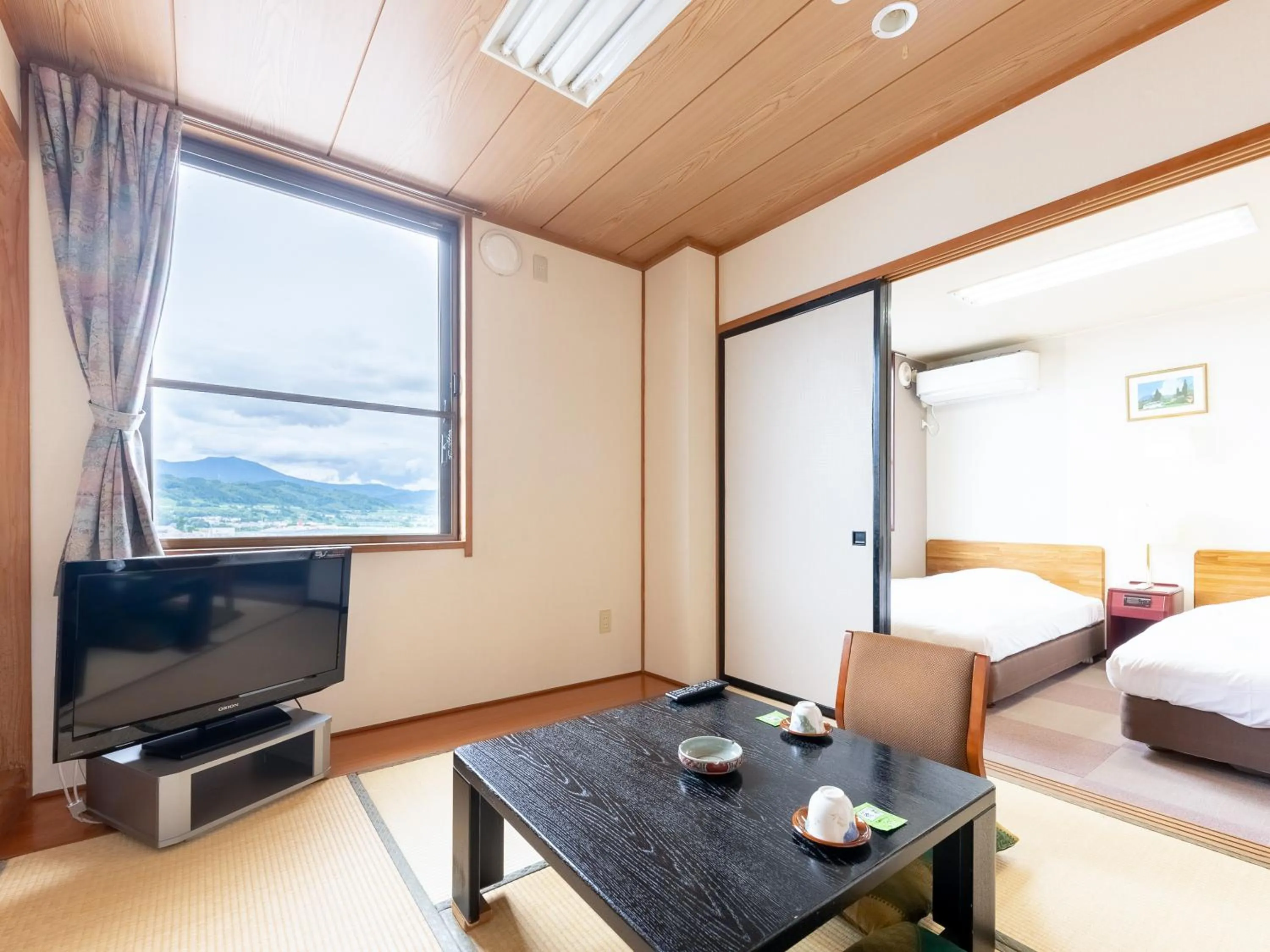 Bed in Tabist Travel Inn Shinshu Nakano