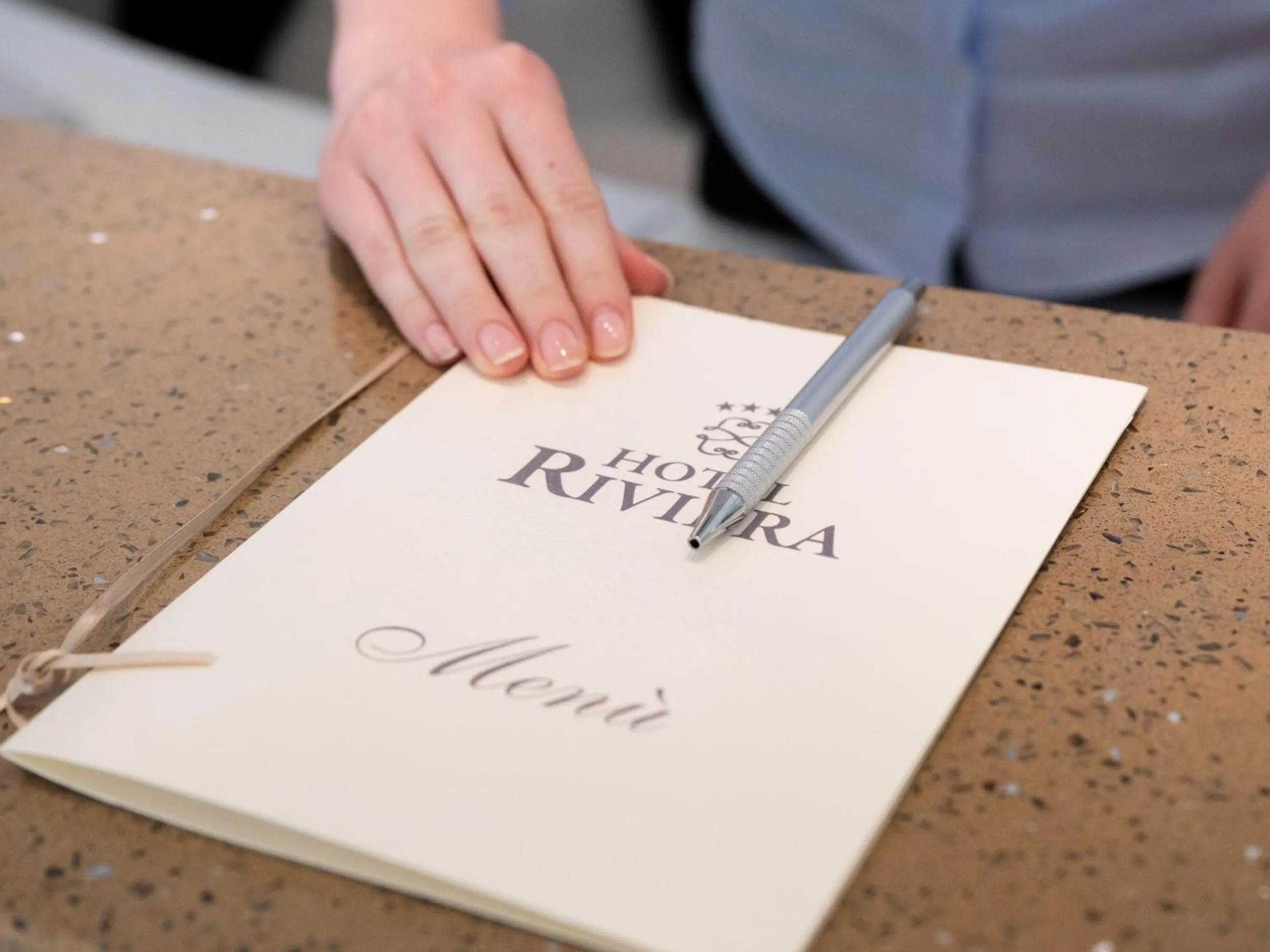 Property logo or sign in Hotel Riviera