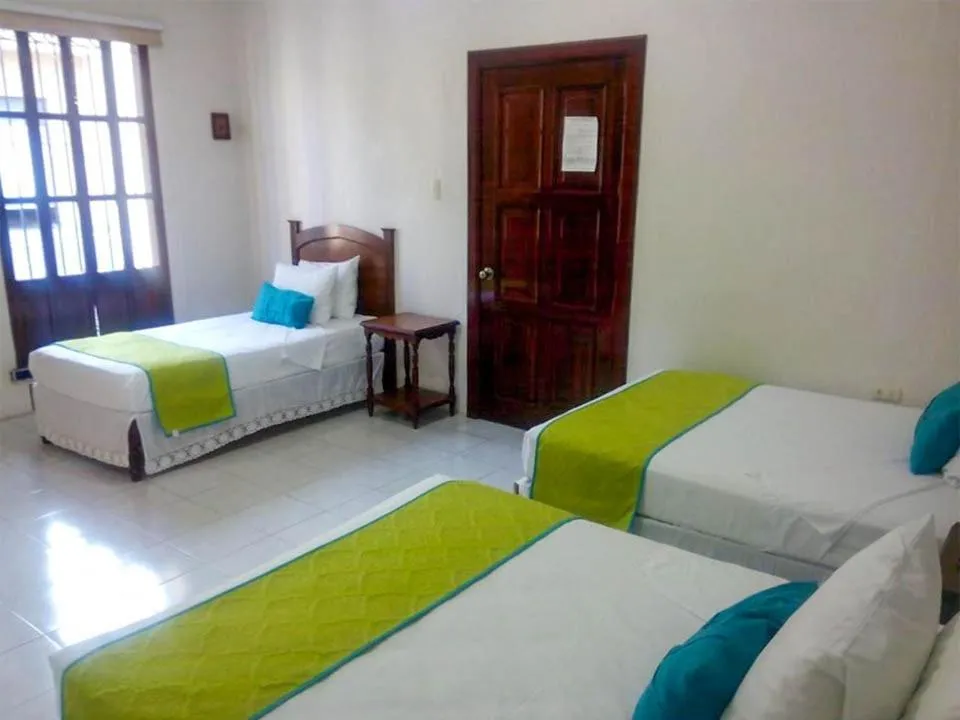 Bed in Hotel Casa Blanca by Rotamundos