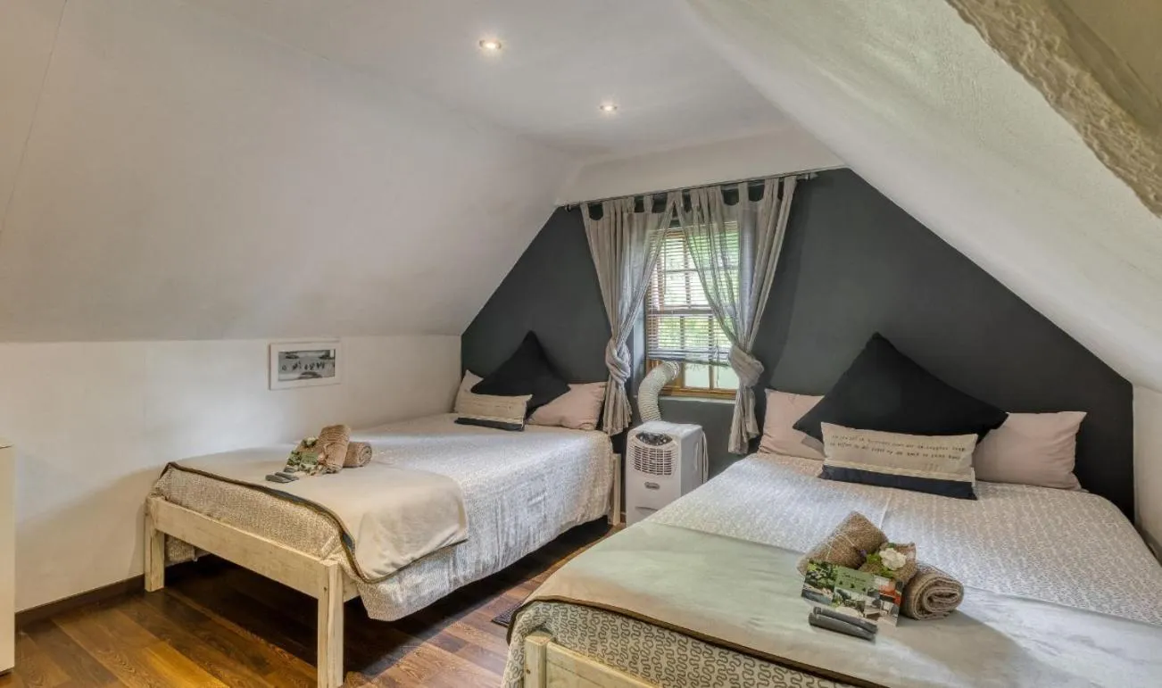 Bed in B&B Sauvignon Country Lodge