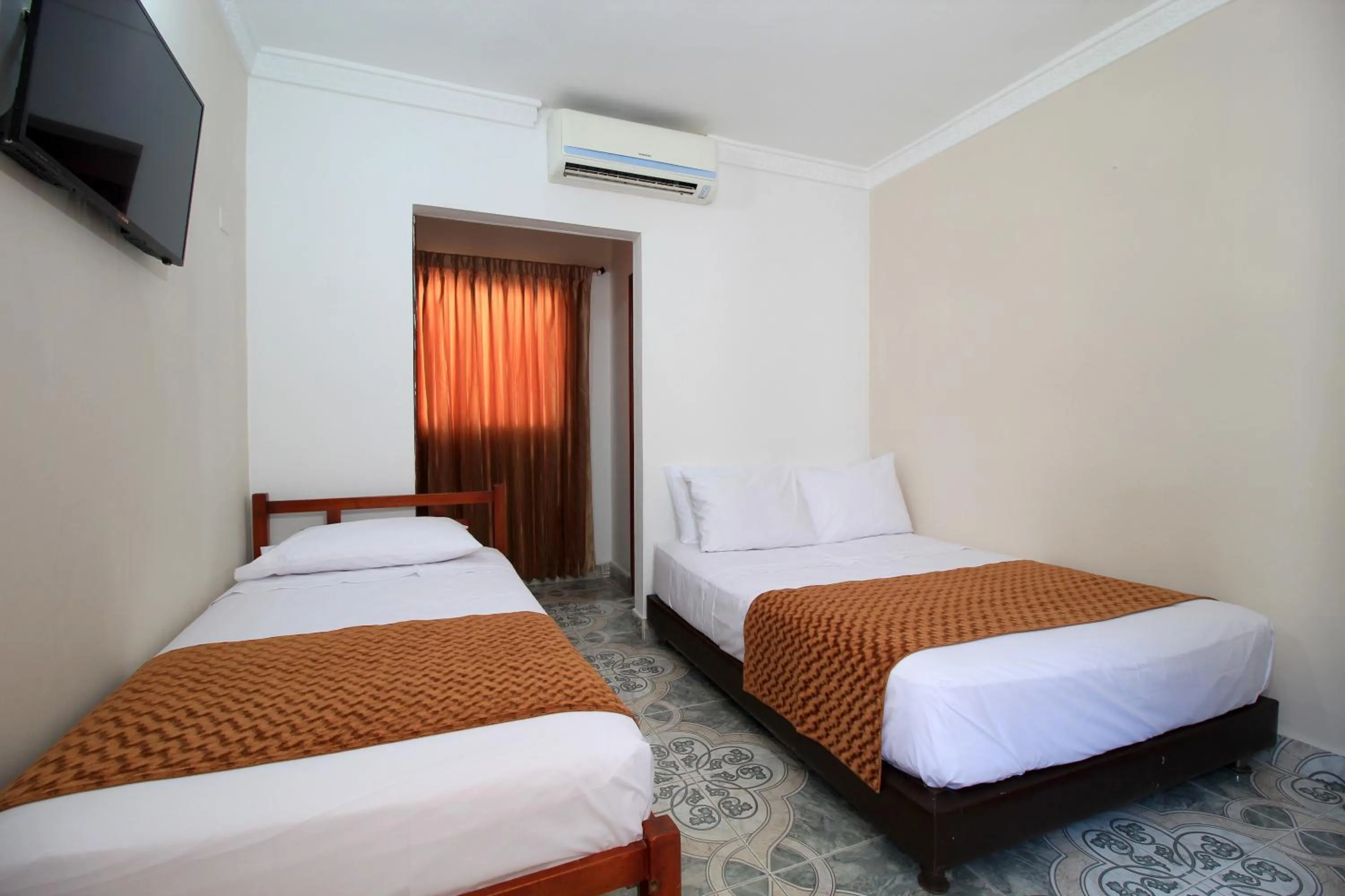 Bedroom, Bed in Hotel Rodadero Inn By GEH Suites