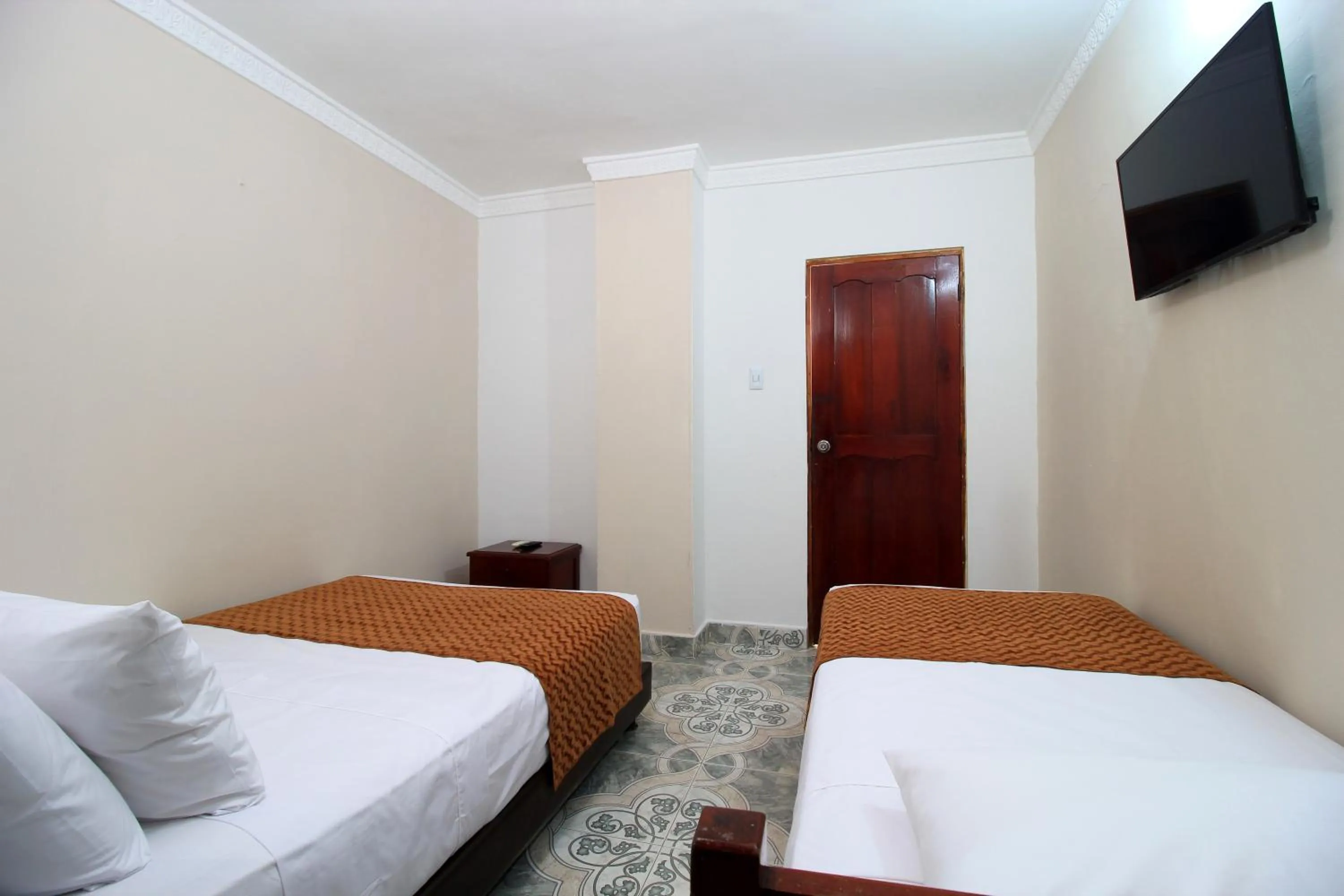 Bed in Hotel Rodadero Inn By GEH Suites