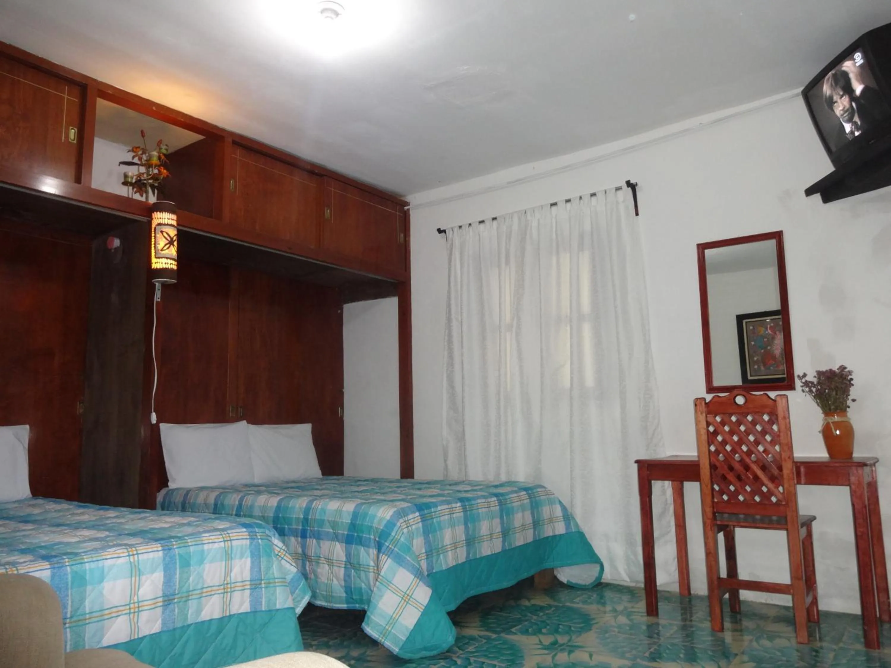 Quadruple Room with Garden View in Hotel Posada El Gran Cipres