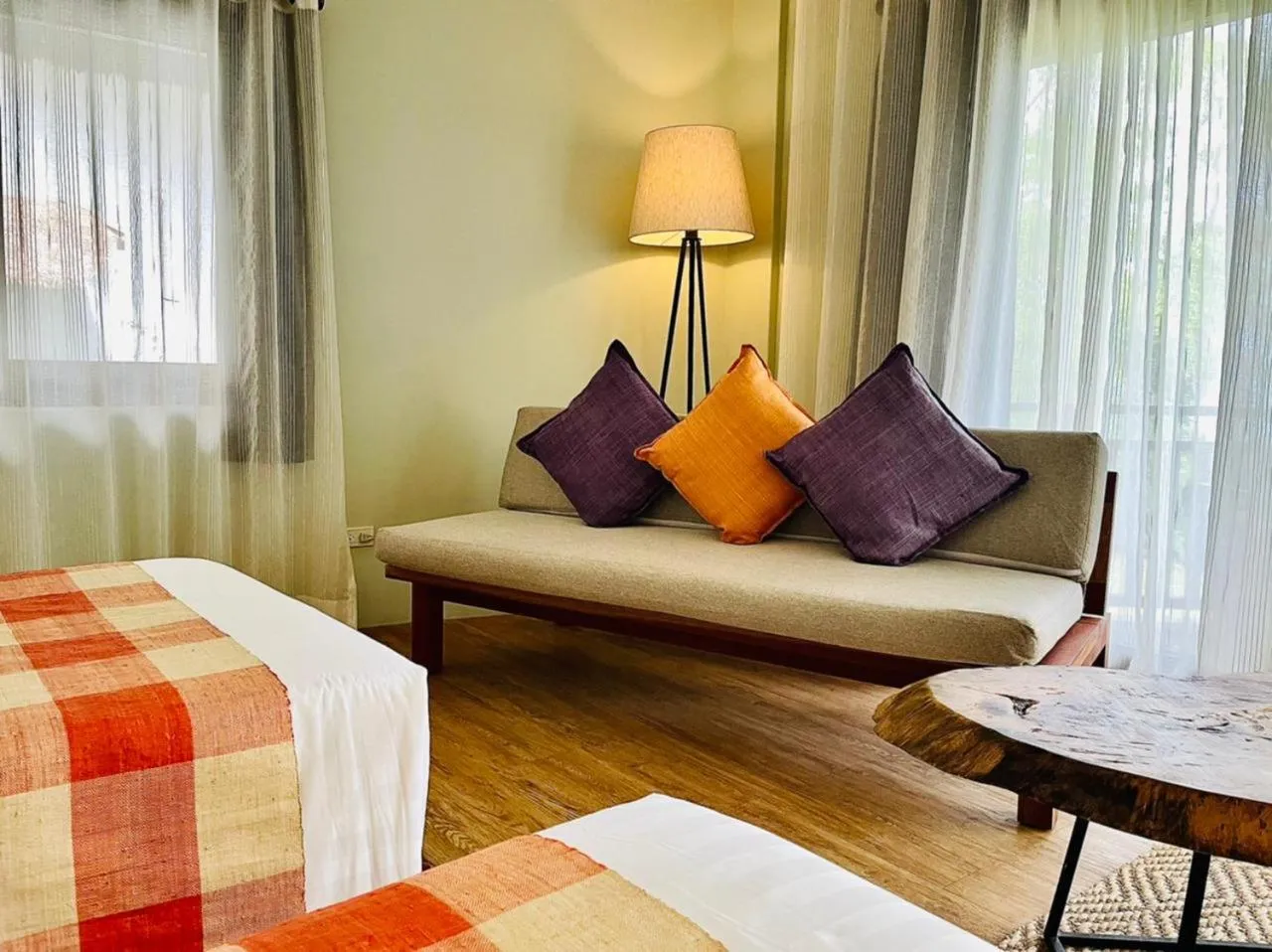 Seating area, Bed in Amun Ini Beach Resort & Spa