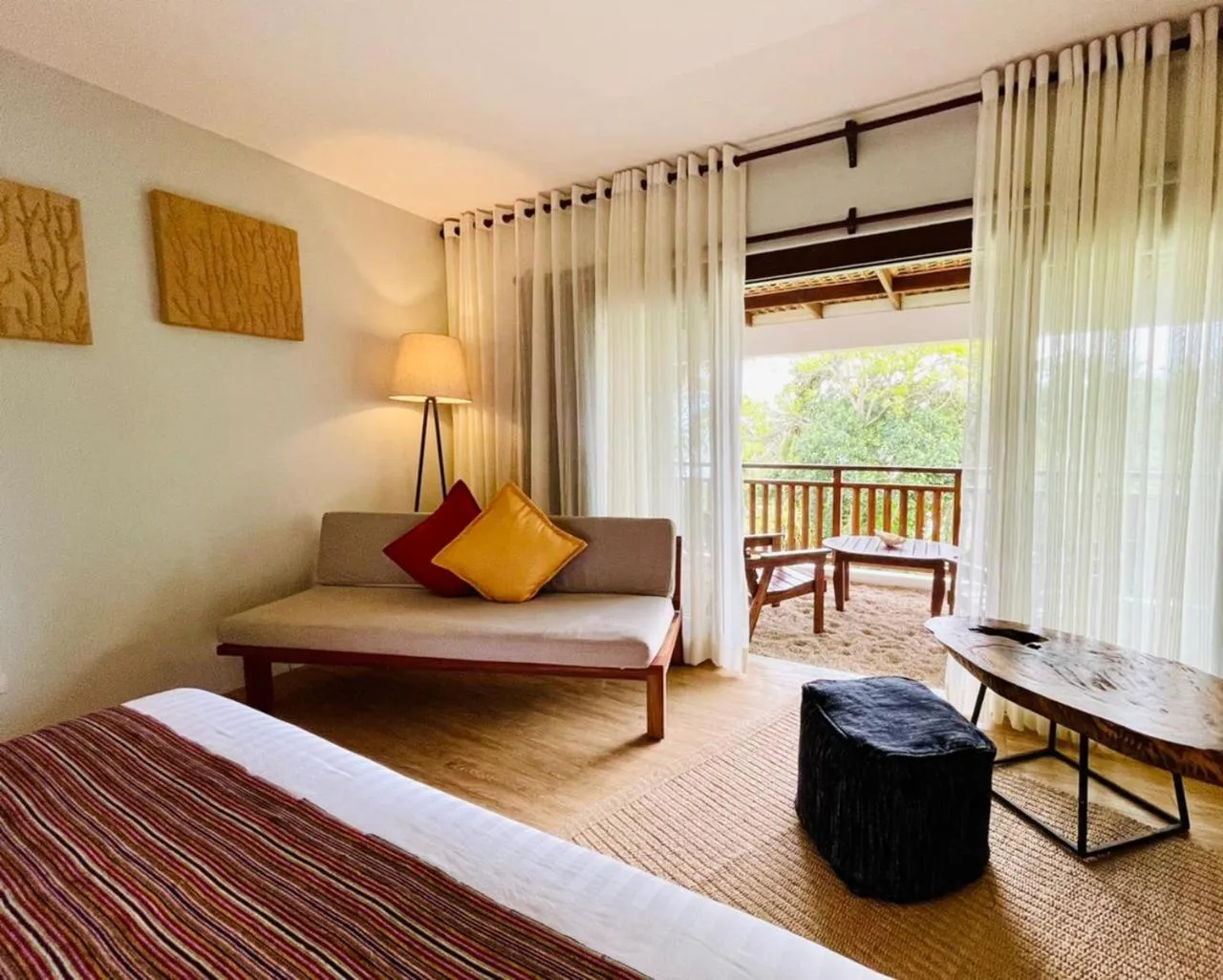 Seating area, Bed in Amun Ini Beach Resort & Spa