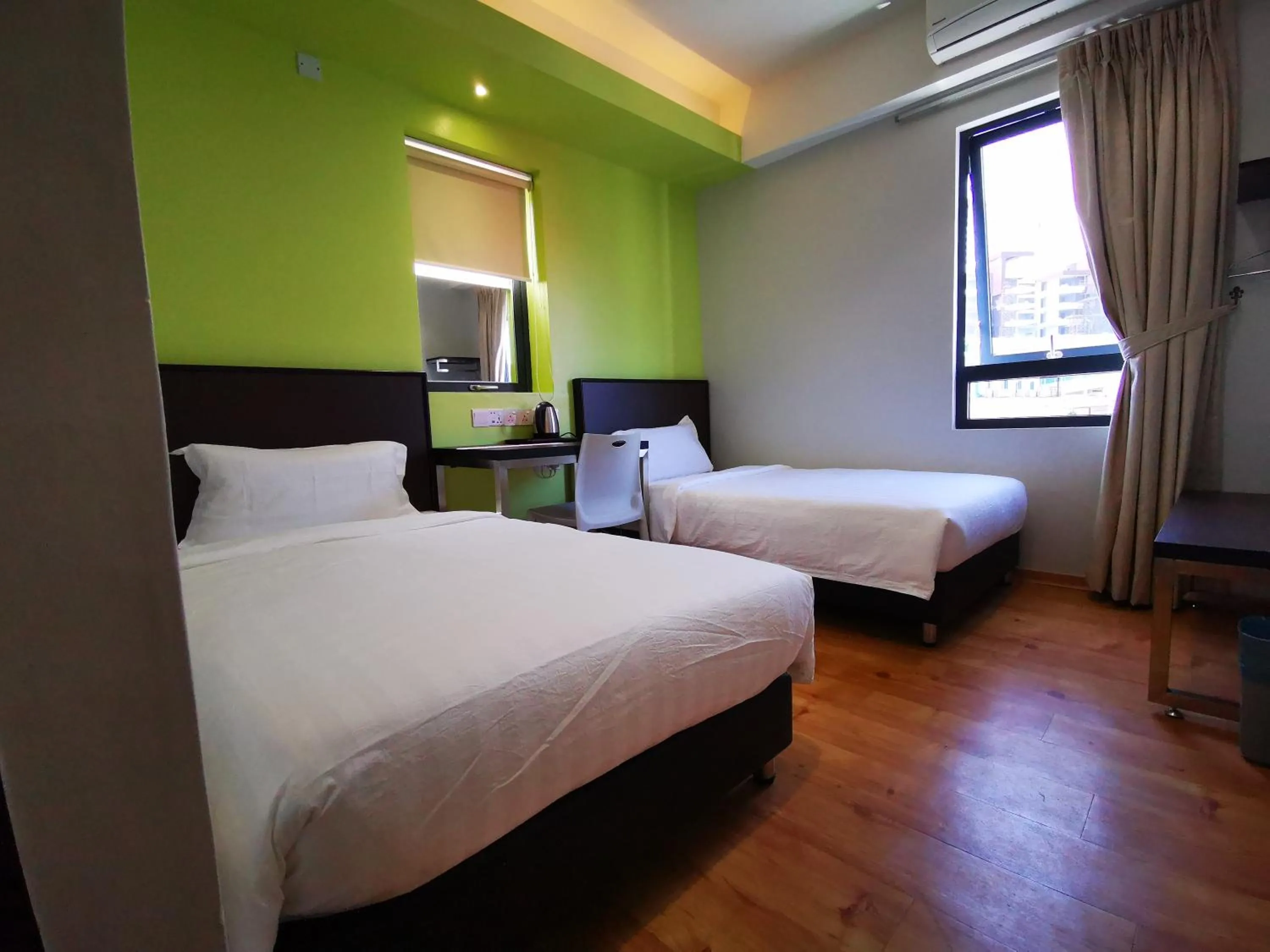 Photo of the whole room, Bed in D'Green Hotel Kuching