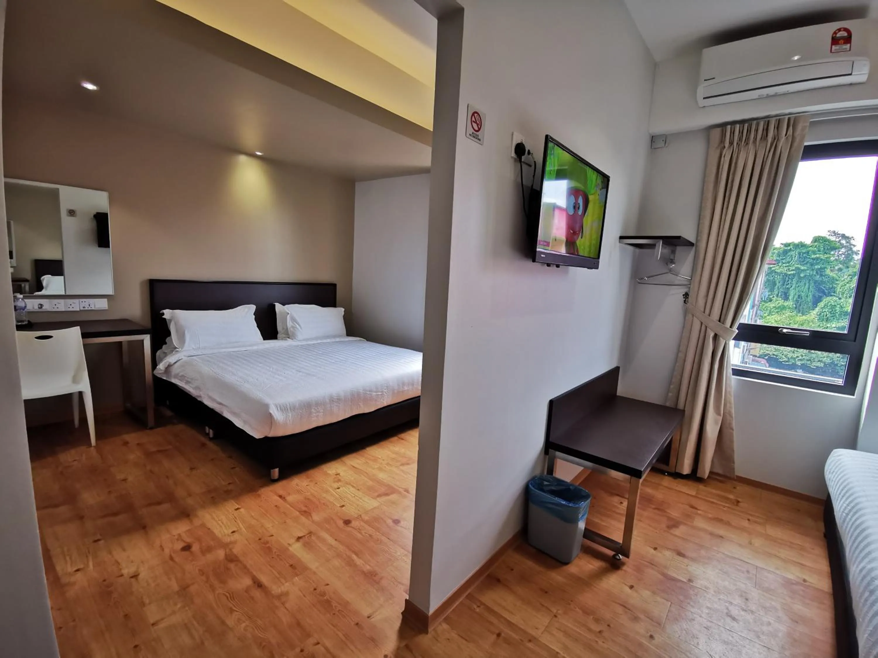 Photo of the whole room, Bed in D'Green Hotel Kuching