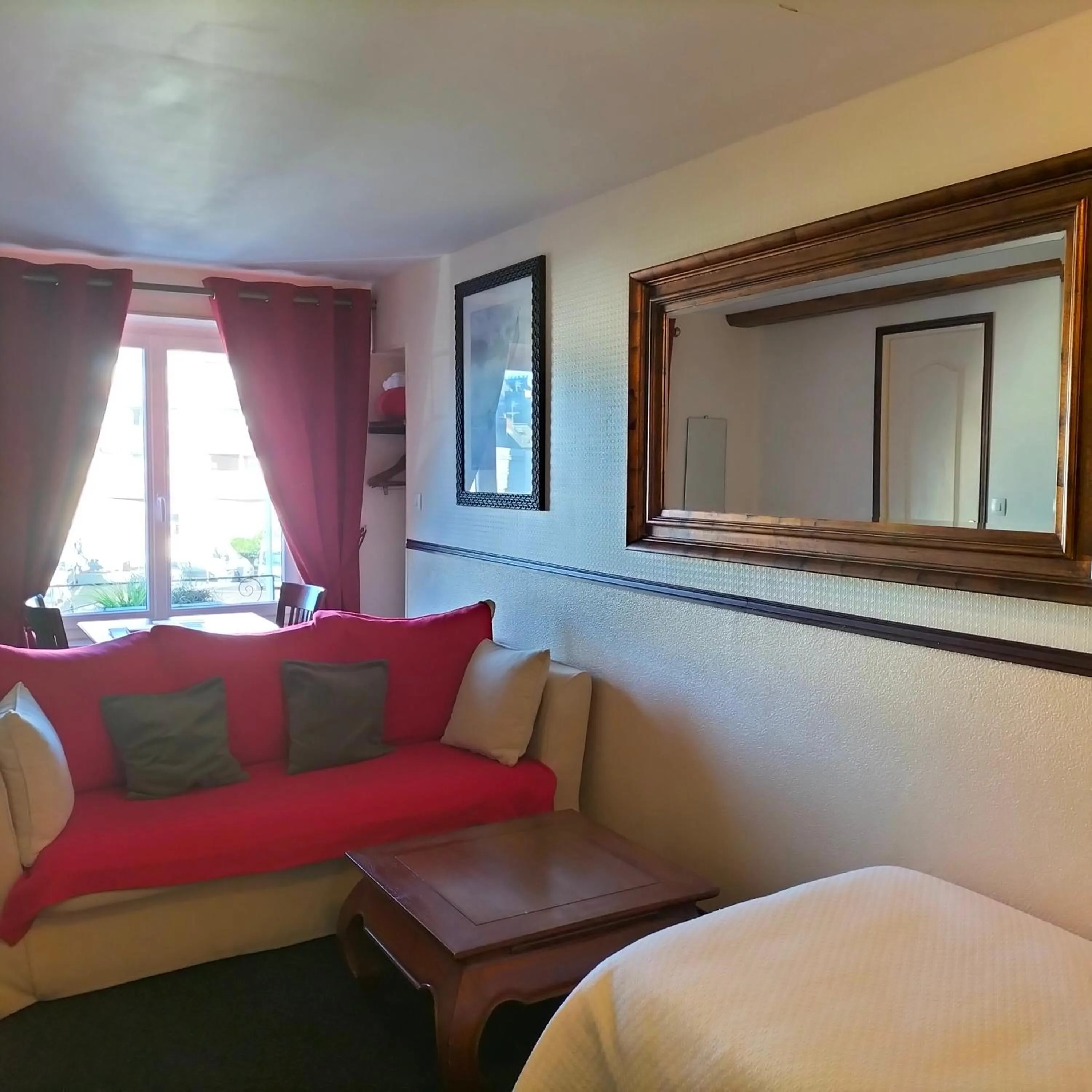 Seating area in Logis HOTEL RESTAURANT La Régence