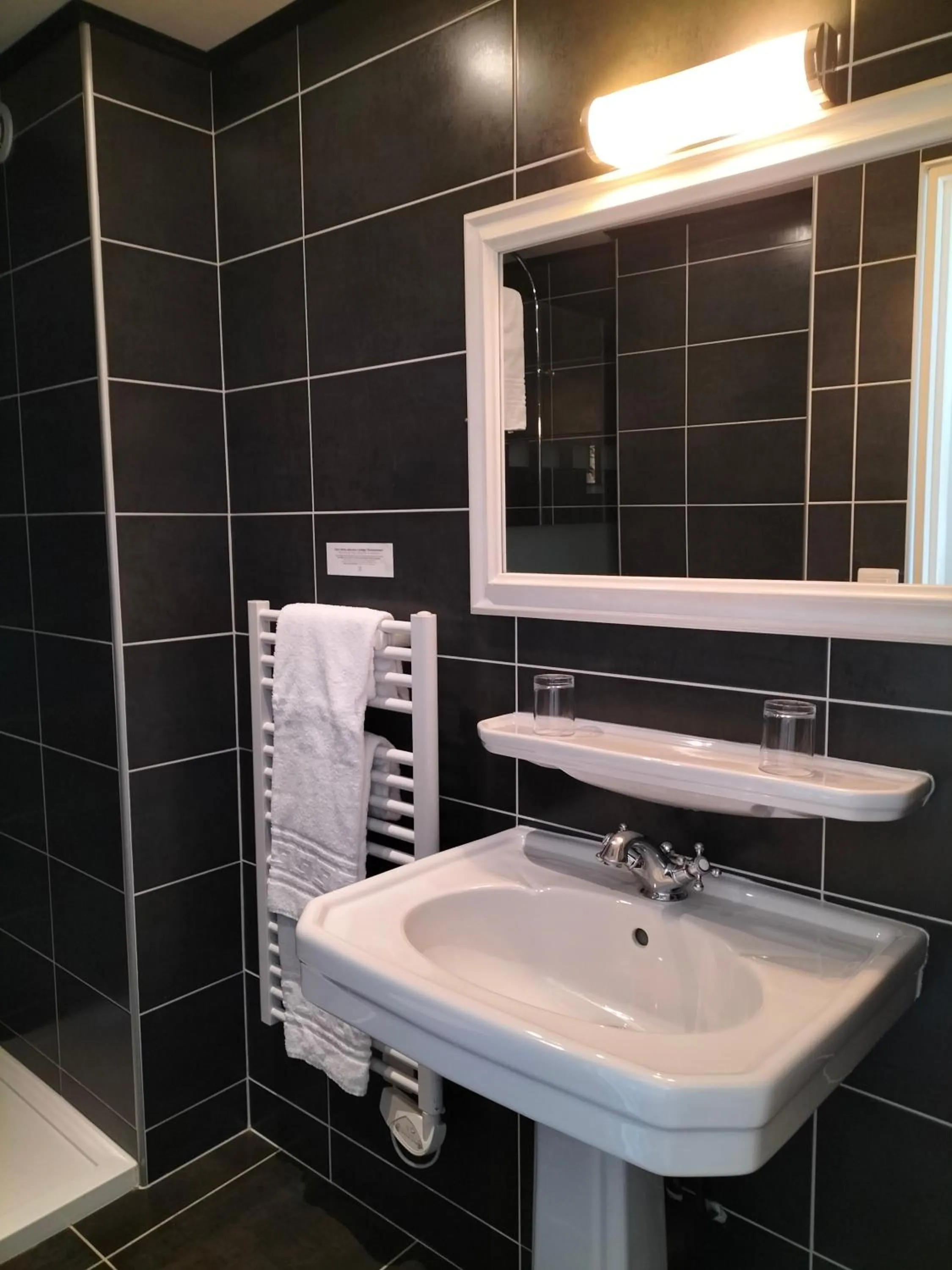 Bathroom in Logis HOTEL RESTAURANT La Régence