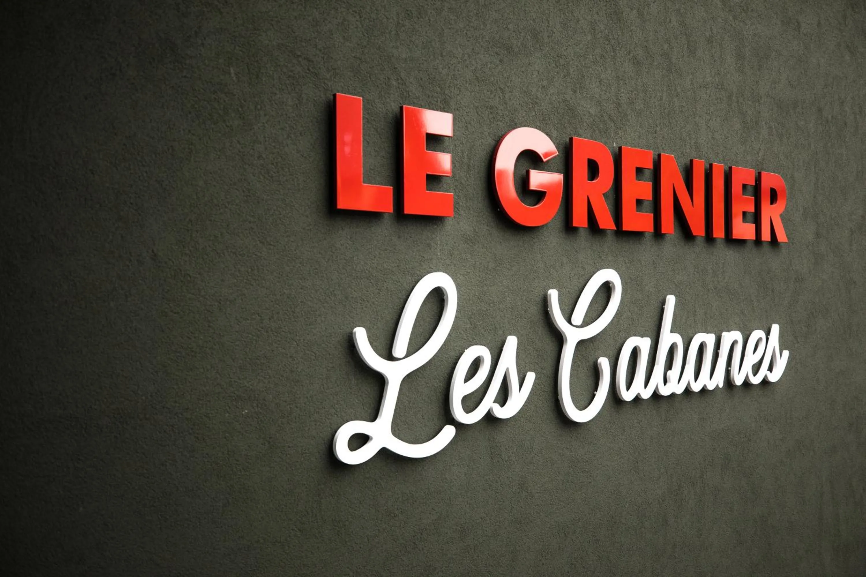 Property logo or sign in La Maison Rouge