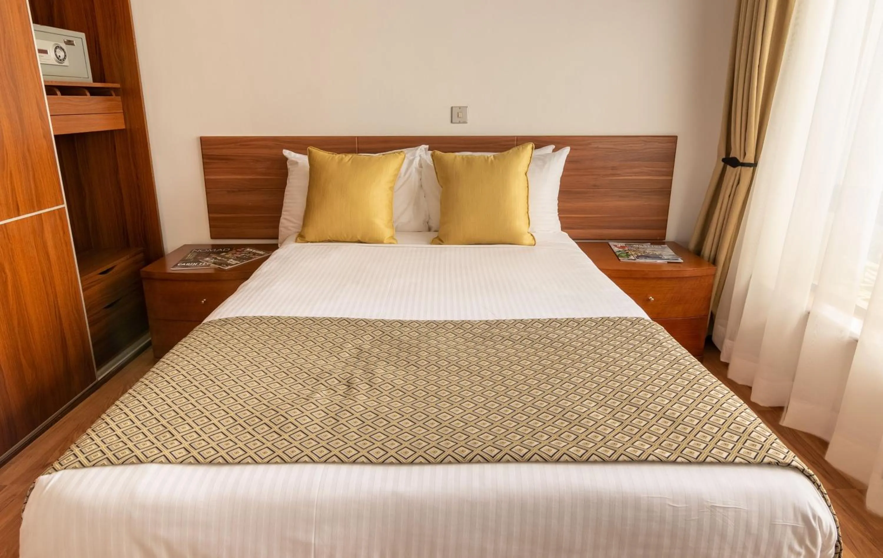 Bed in CySuites Apartment Hotel