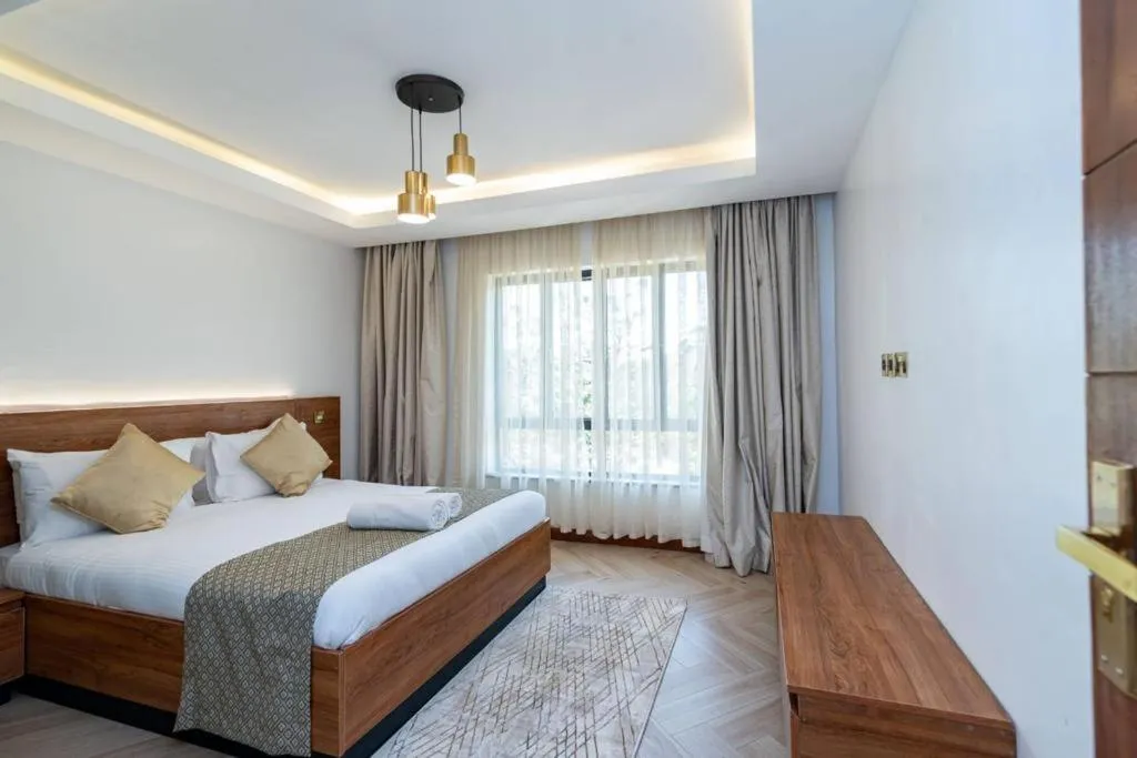 Bed in CySuites Apartment Hotel