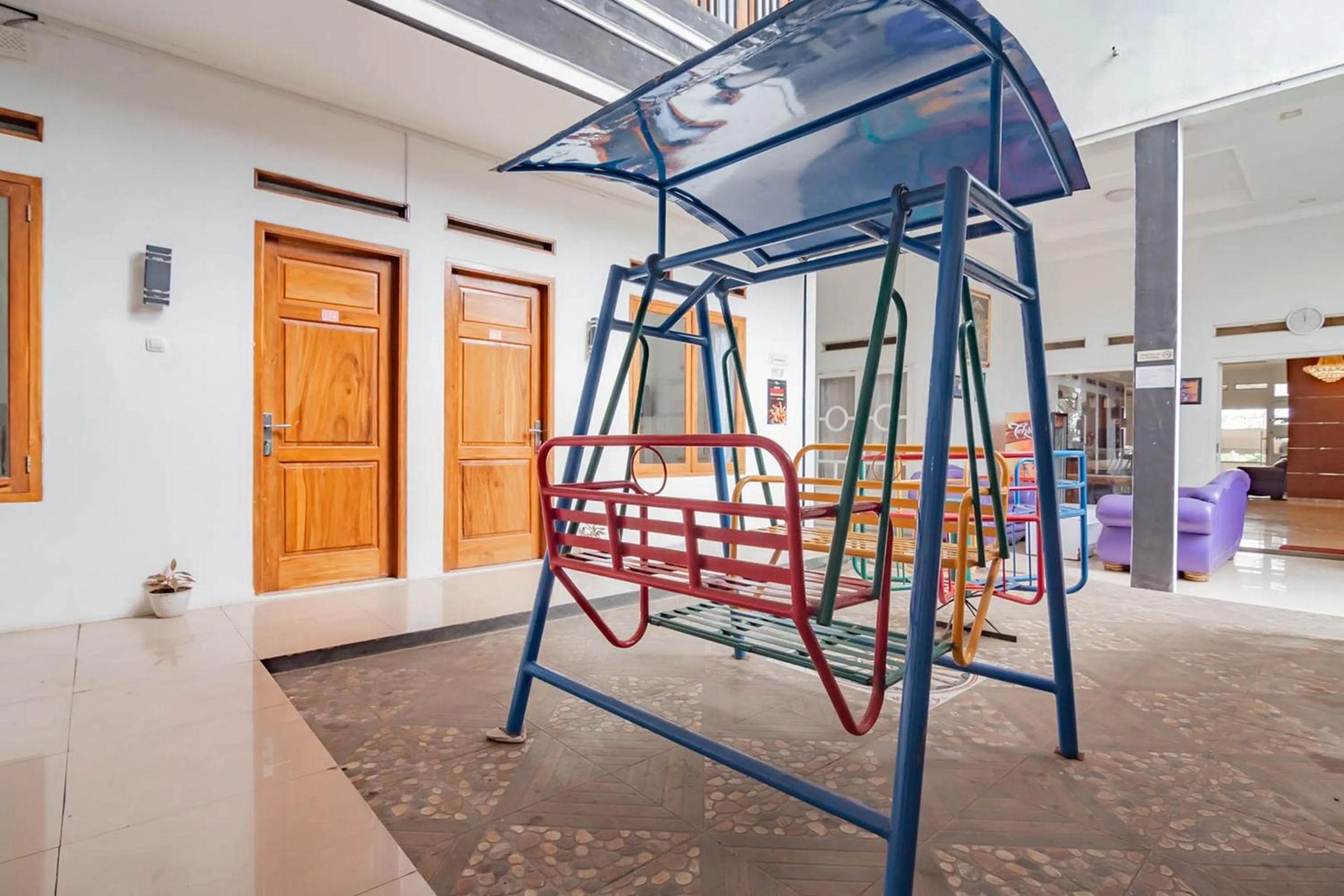 Children play ground in Urbanview Hotel One Family Maribaya by RedDoorz