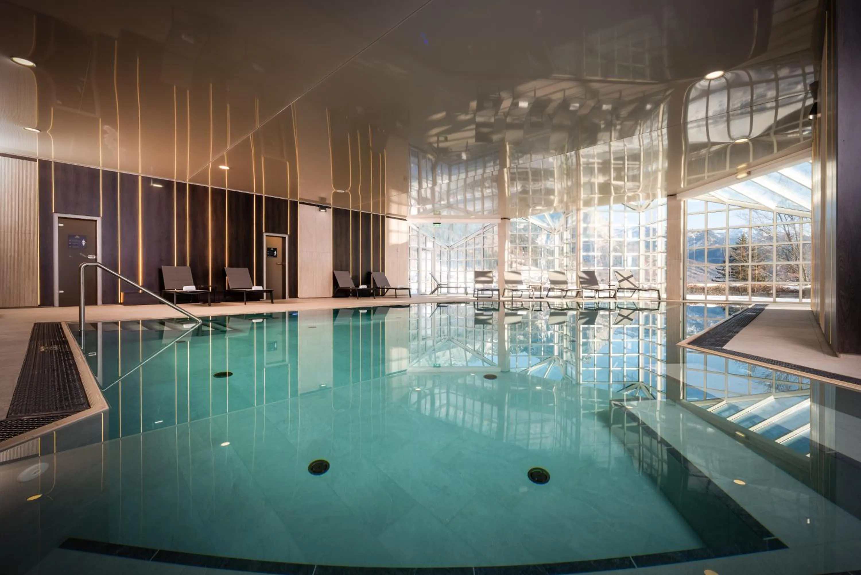 Pool view in MONDI Chalets am Grundlsee