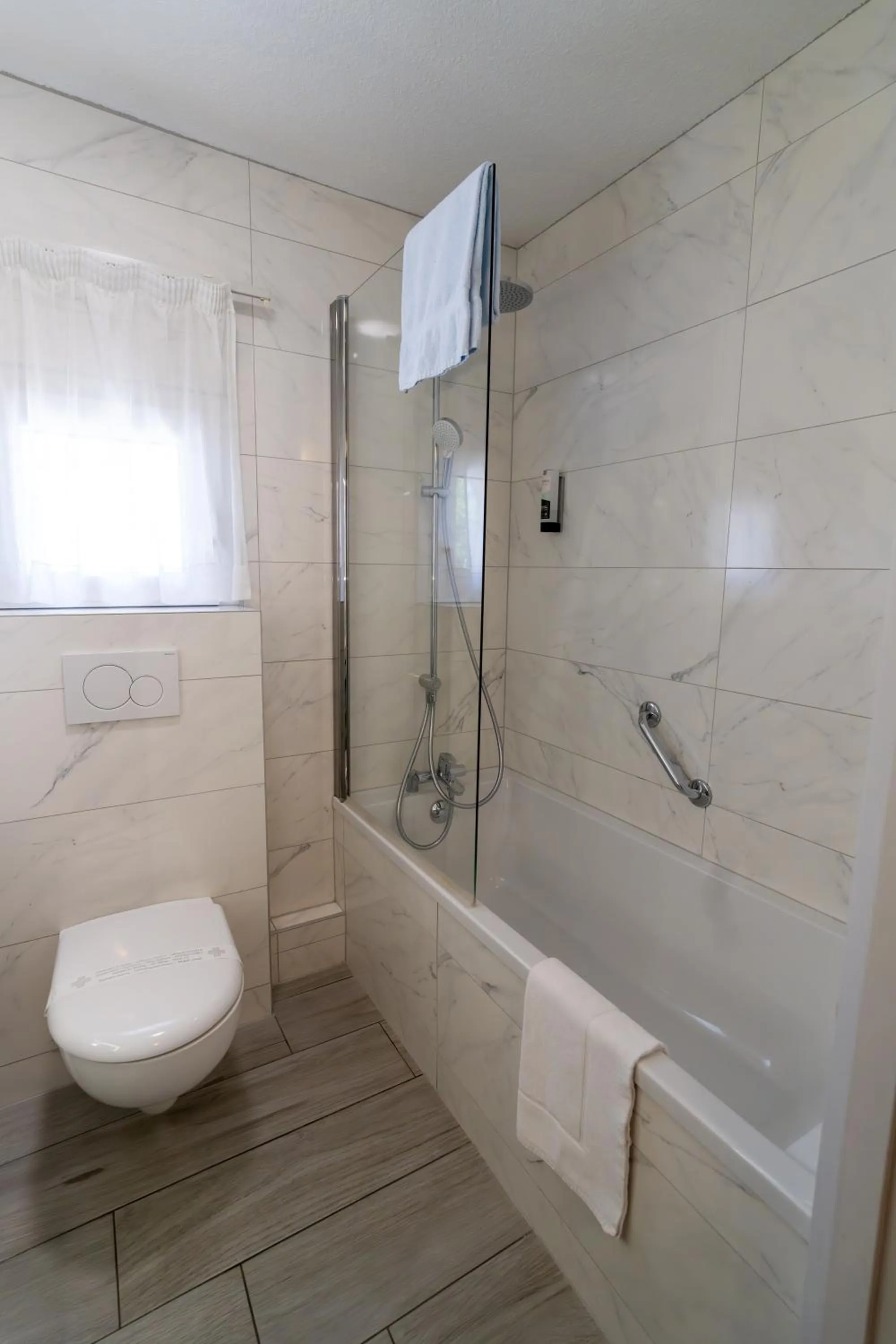 Toilet in Logis Hotel Arc En Ciel