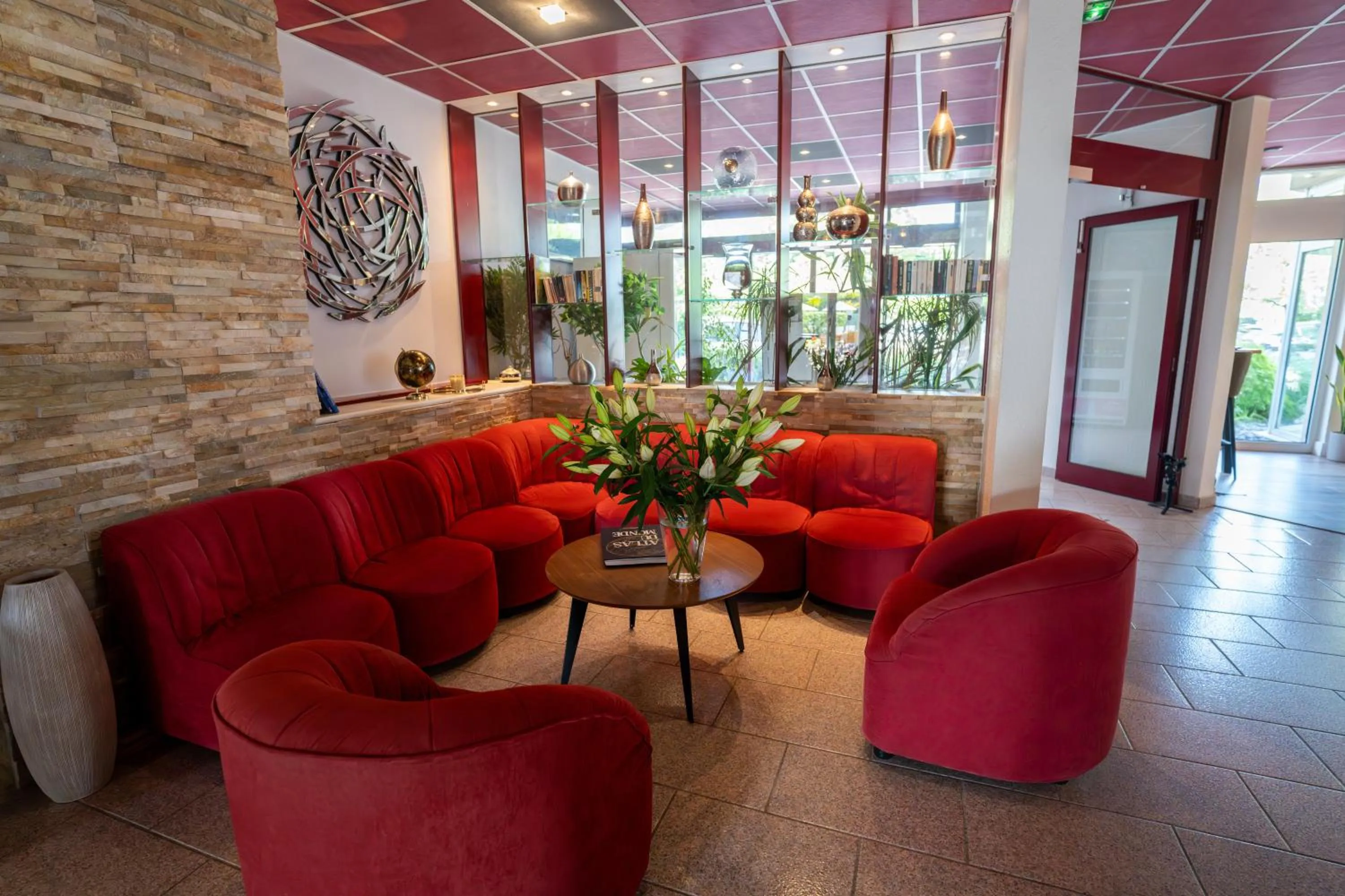 Living room in Logis Hotel Arc En Ciel