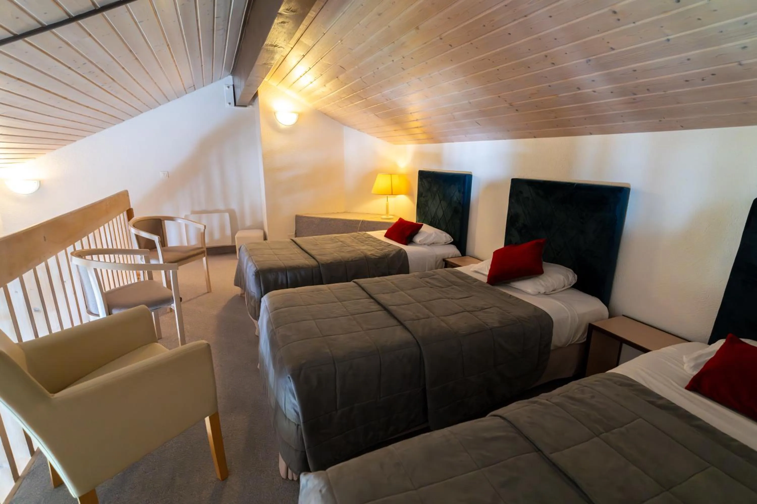 Bed in Logis Hotel Arc En Ciel