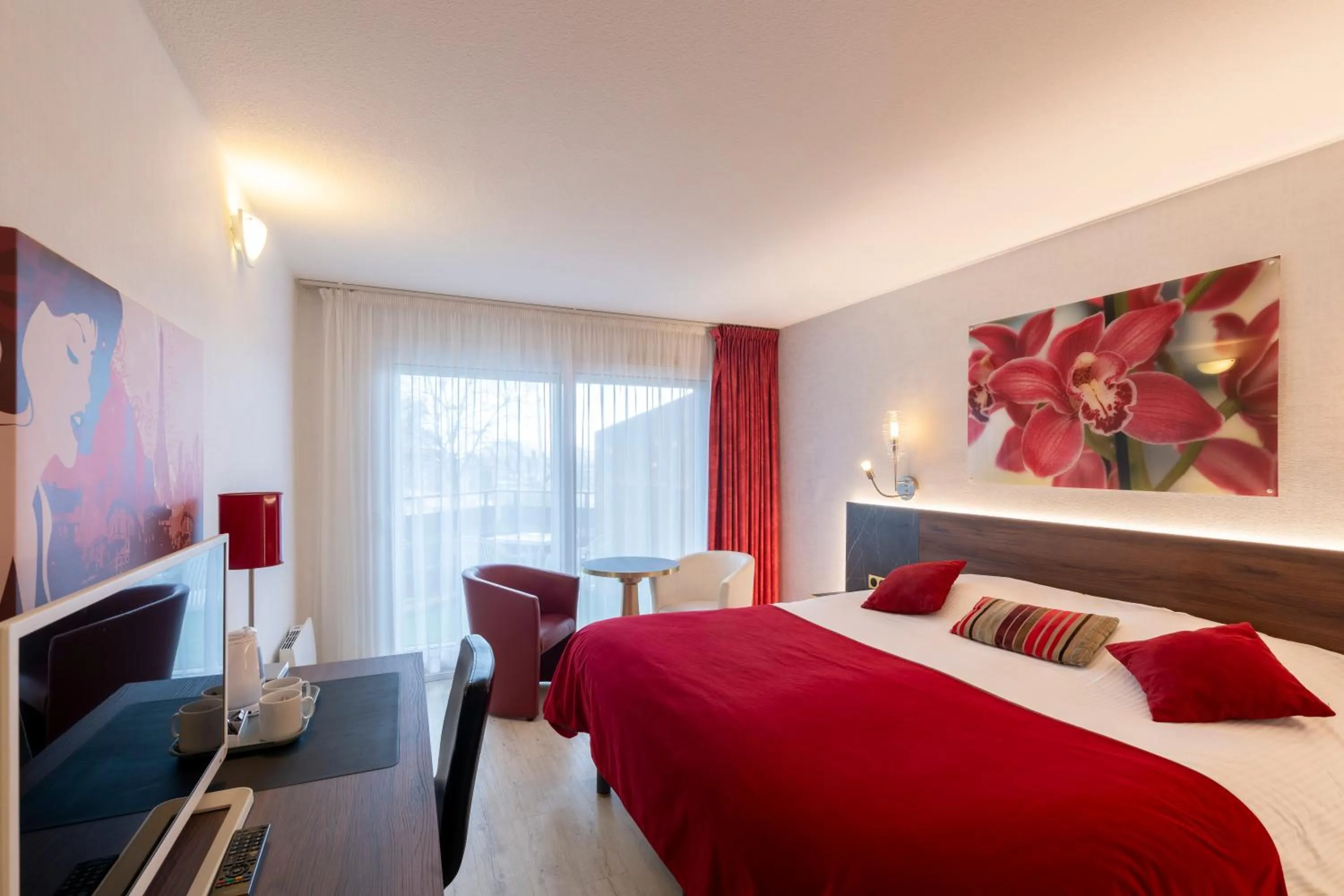 Bed in Logis Hotel Arc En Ciel