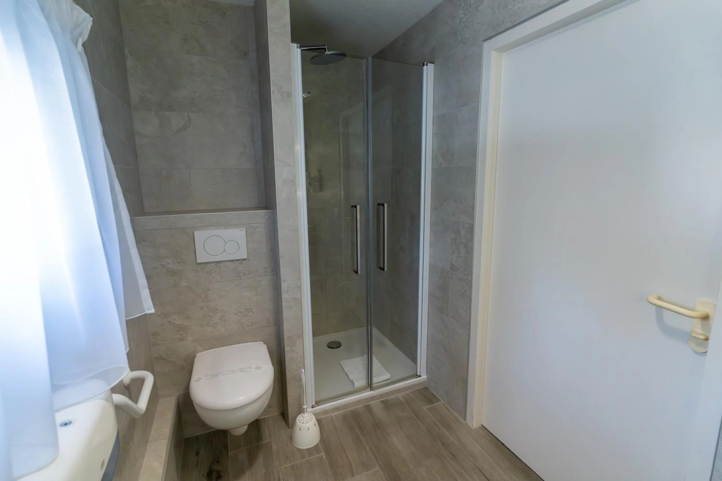 Shower in Logis Hotel Arc En Ciel