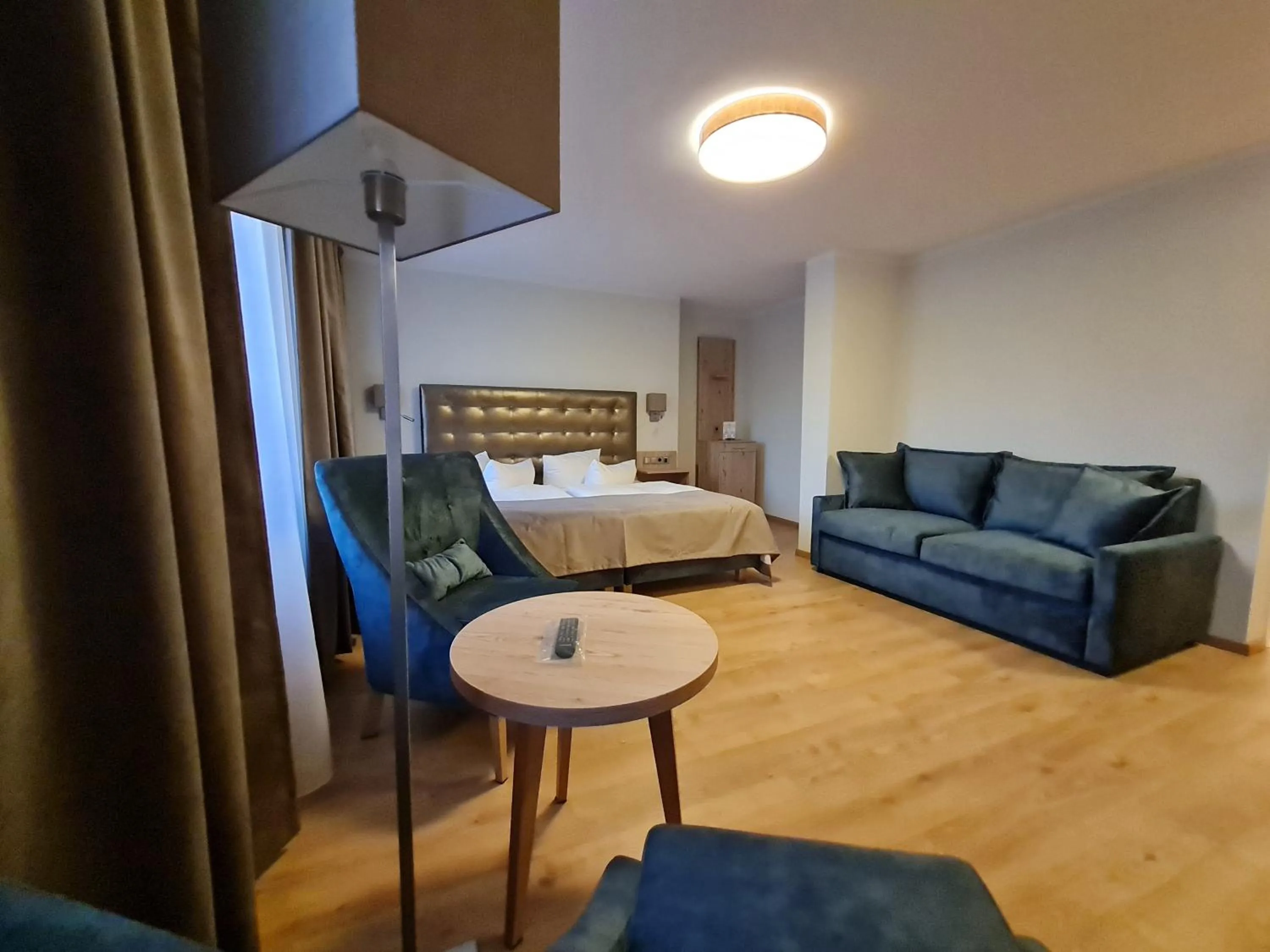 Seating area, Bed in Seehotel Fährhaus